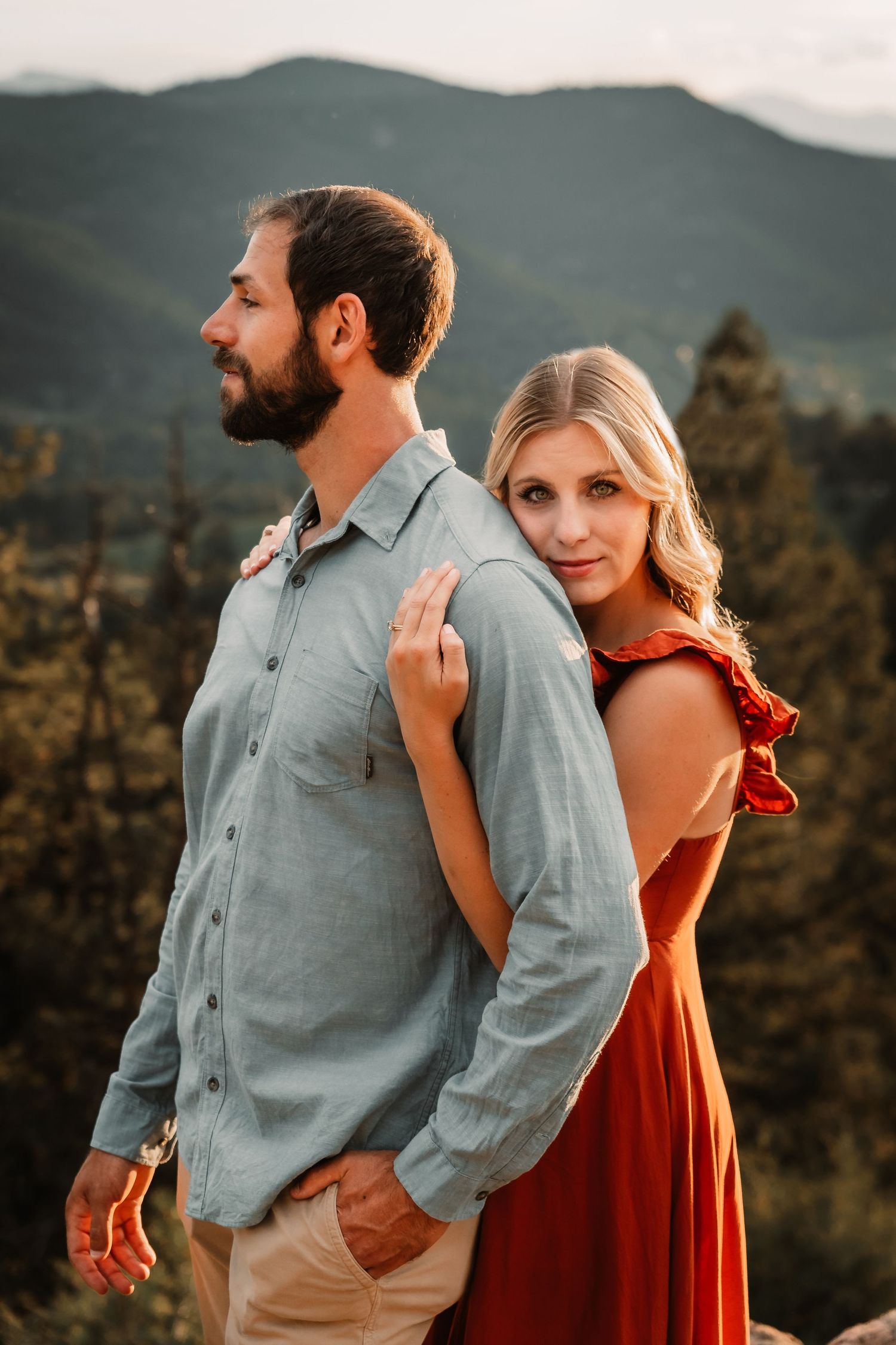 Couple embracing with mountain views at golden hour by Vine Photography in Salem Ohio