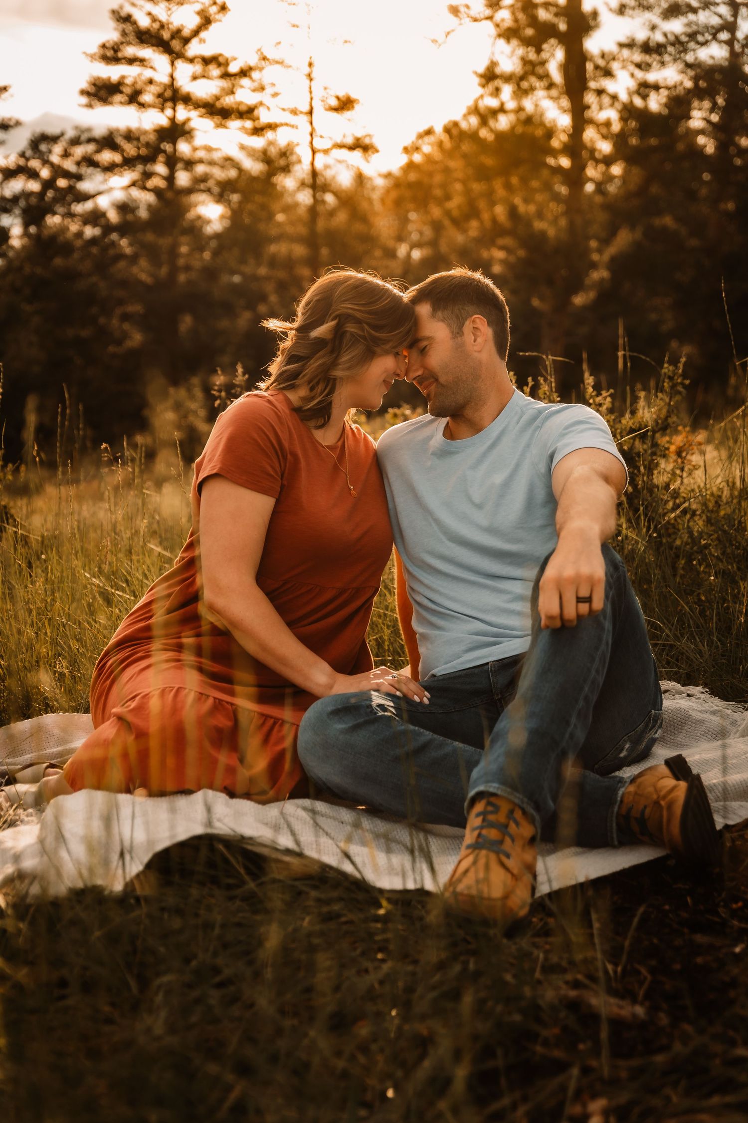 Couple sitting on blanket almost kissing by Vine Photography in Salem Ohio