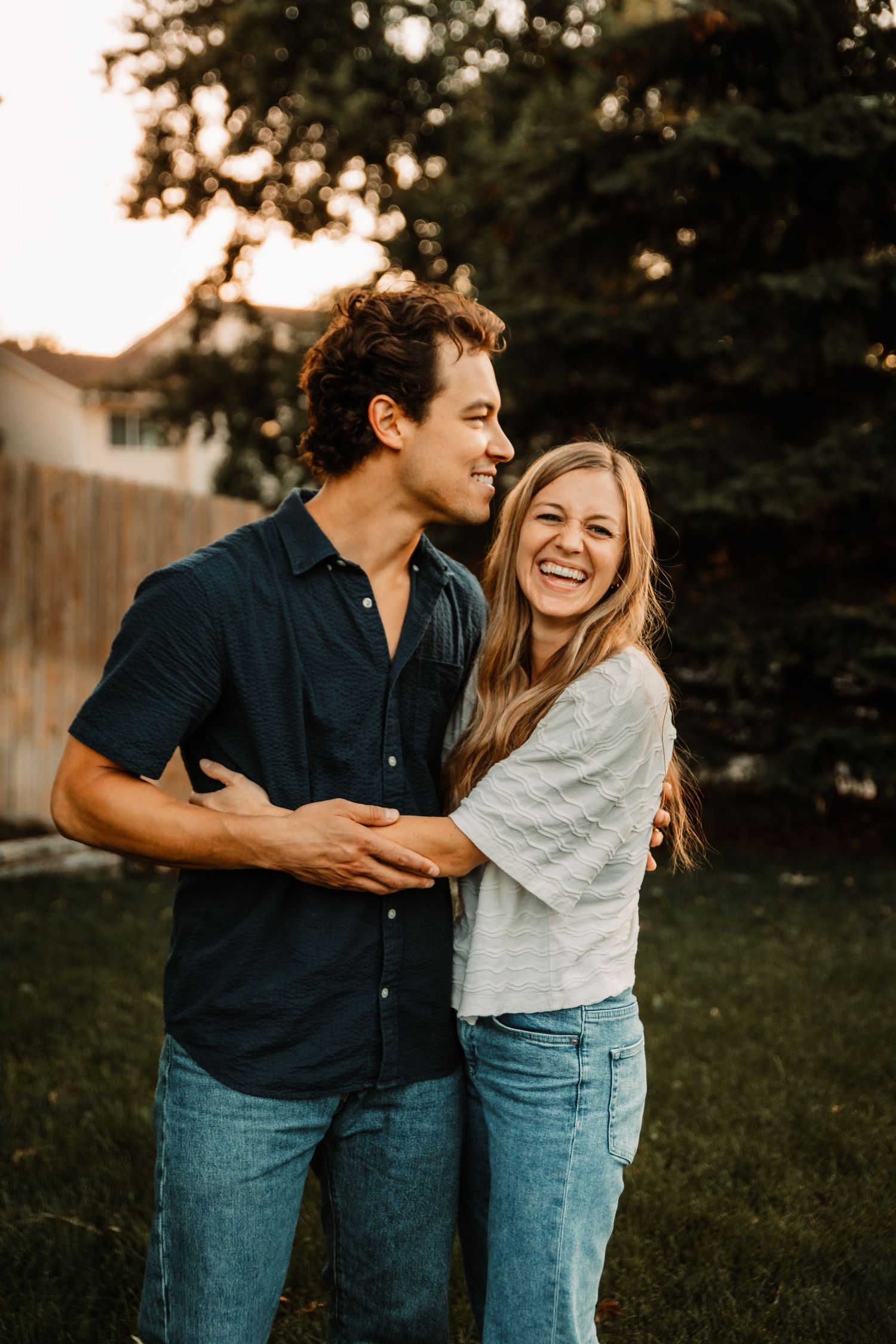 couple embracing while laughing by Vine Photography in Salem Ohio