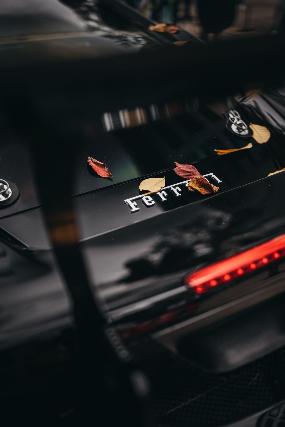 Close-up of dark gaming keyboard with illuminated keys and custom keycaps.