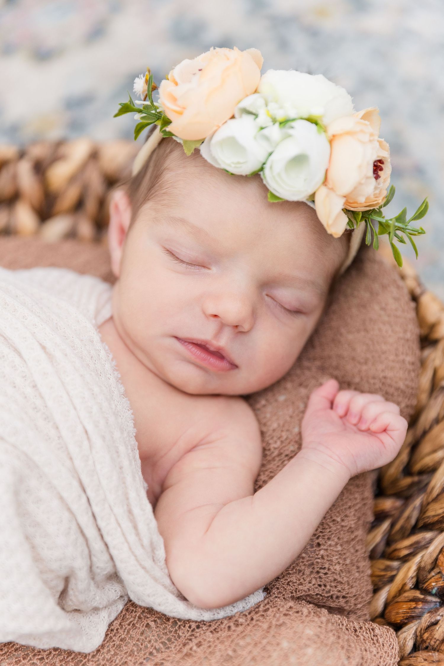 newborn portrait in basket with flower crown