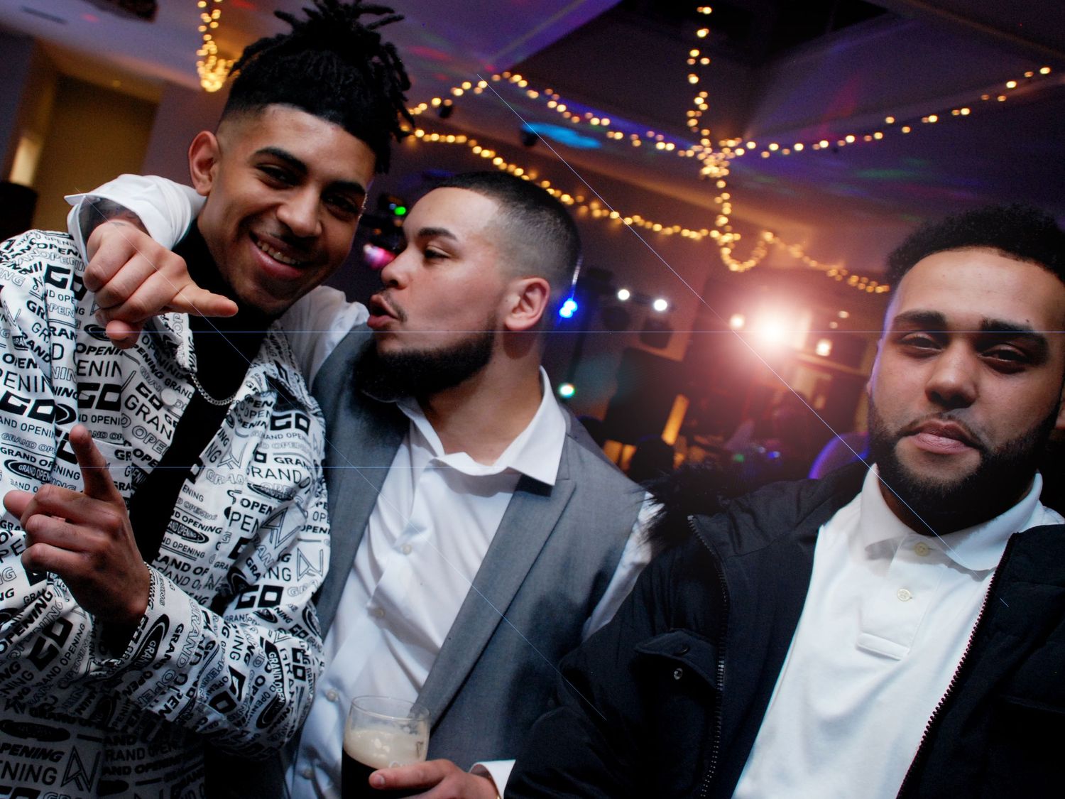 Wedding Photographer Warwickshire - Groom enjoying a joke with his friends