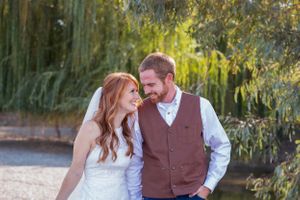 Bride and groom with weeping willow behind them during first look in Orland California Wedding