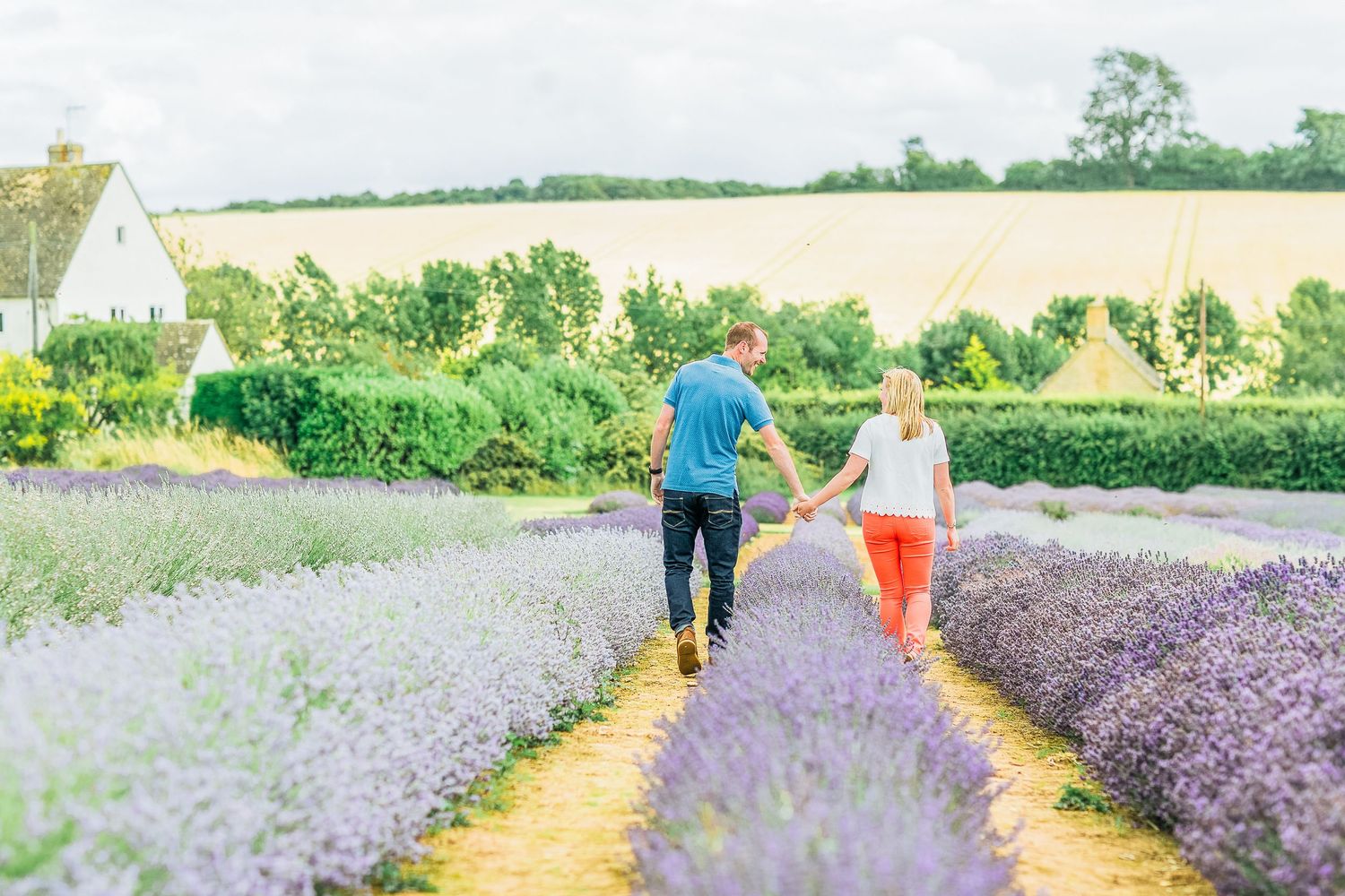 Hayley Elizabeth Photography Cotswolds Photographer Lavender engagement session Snowshill couple holding hands walking