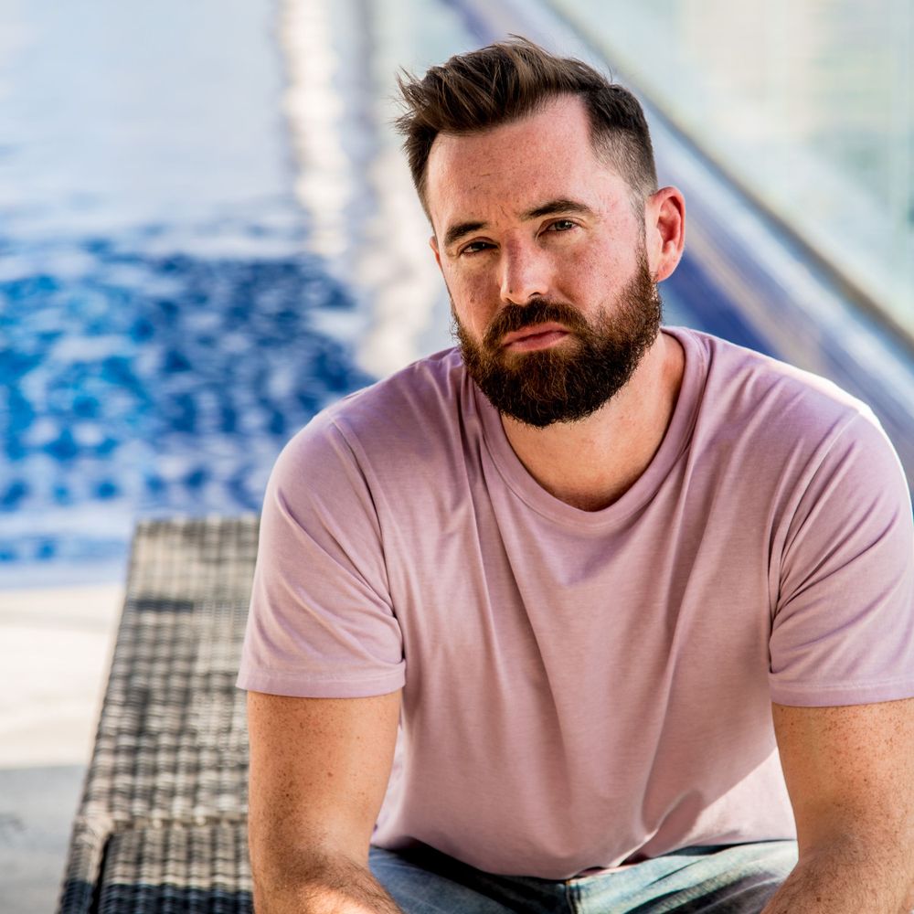 Portrait of Ben by the pool after his photoshoot at Quinta Avenida