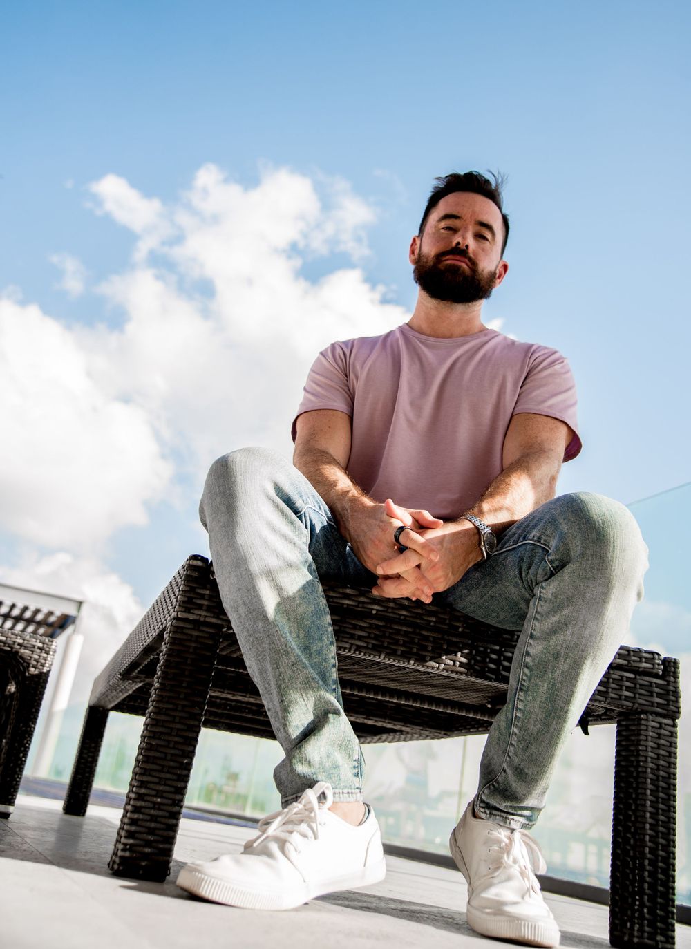 A creative shot of Ben on the rooftop, experimenting with different poses and angles for a unique photo