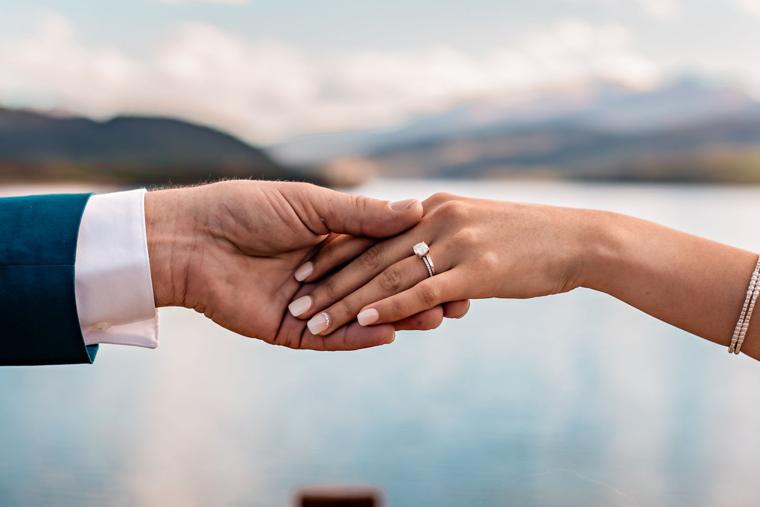 couple holding hands at wedding on Dillon Reservoir