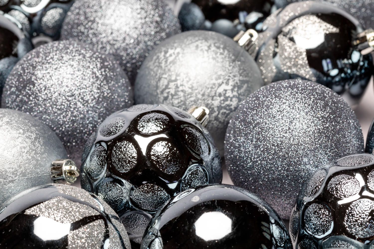 A product packshot of silver Christmas decorations by Danny Loo