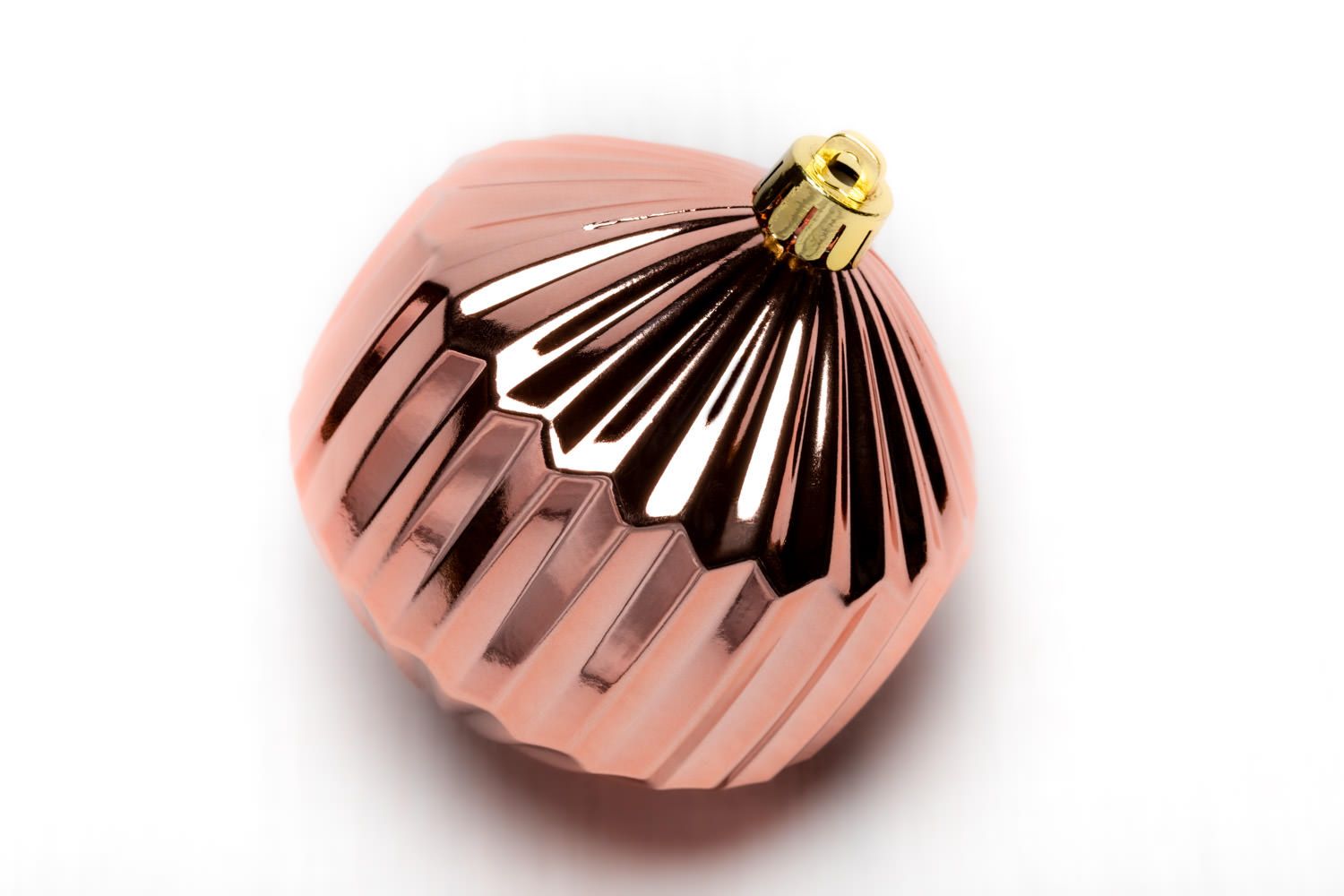 A product packshot of rose gold Christmas decoration by Danny Loo