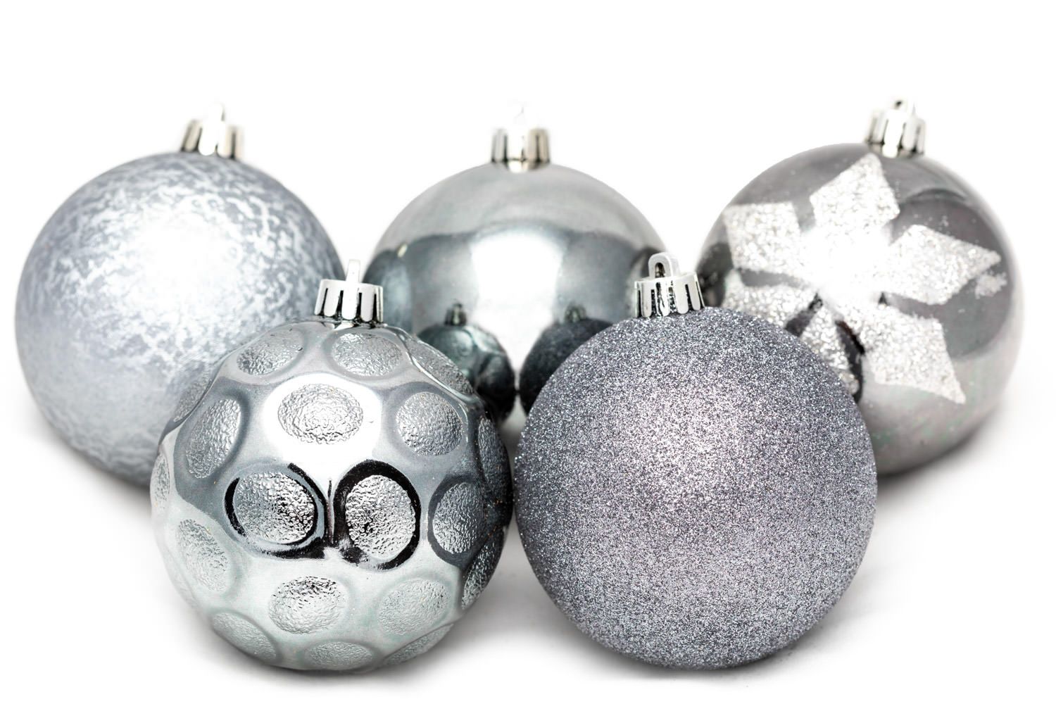 A product packshot of silver Christmas decorations by Danny Loo