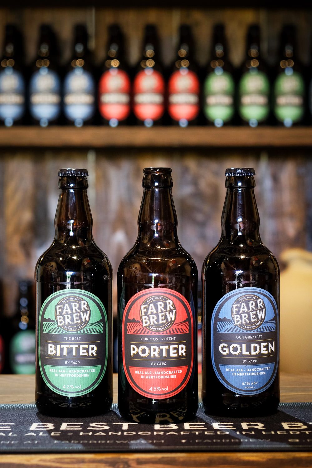 A product shot of beer bottles in a brewery by Danny Loo