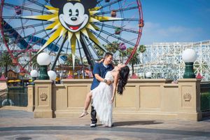 Wide angle view of proposal at Disney California Adventure with Mickey-themed Ferris wheel.