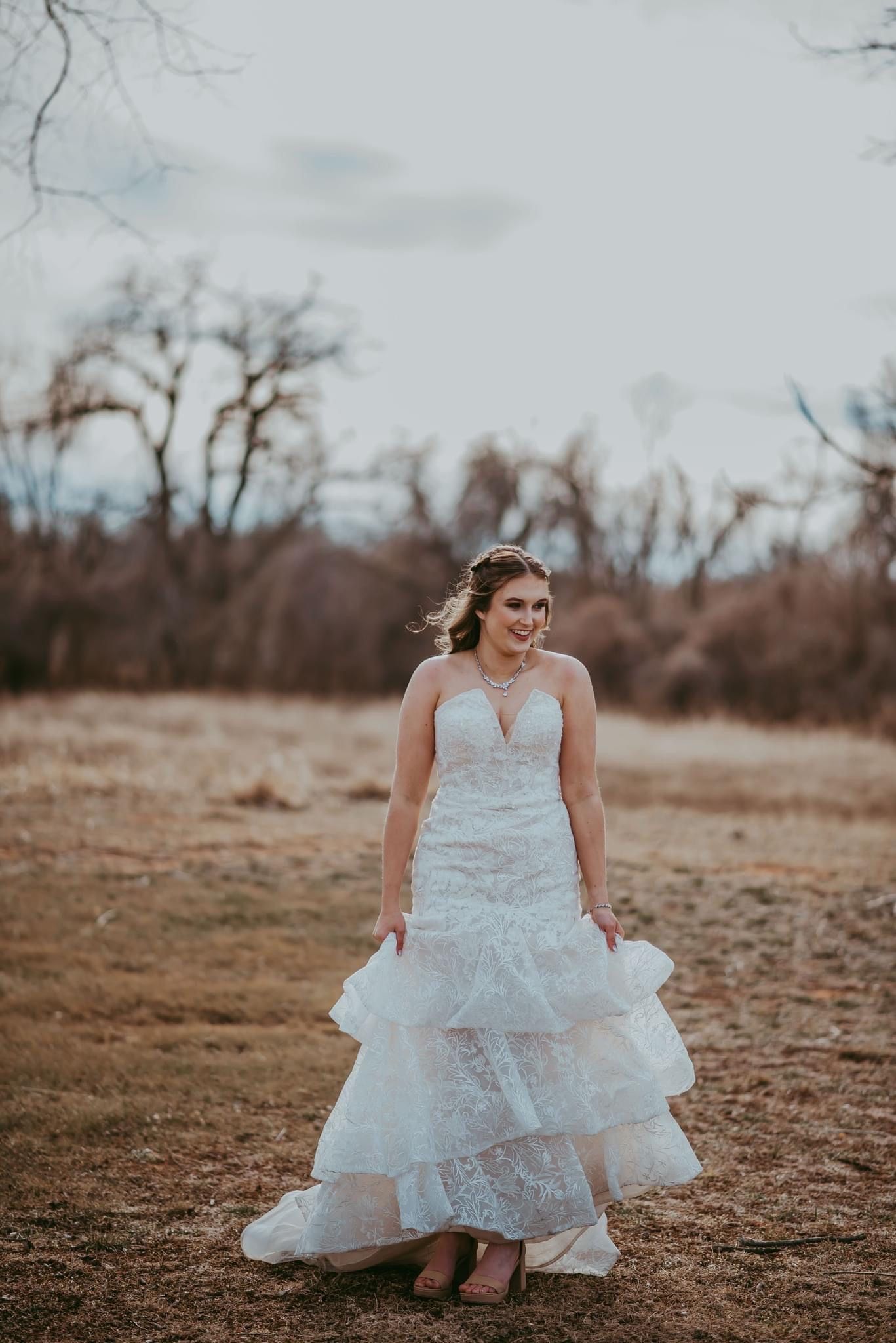 Bride with stunning soft glam makeup by Gaby Makeup Artistry, on a sunny day in Oklahoma City.