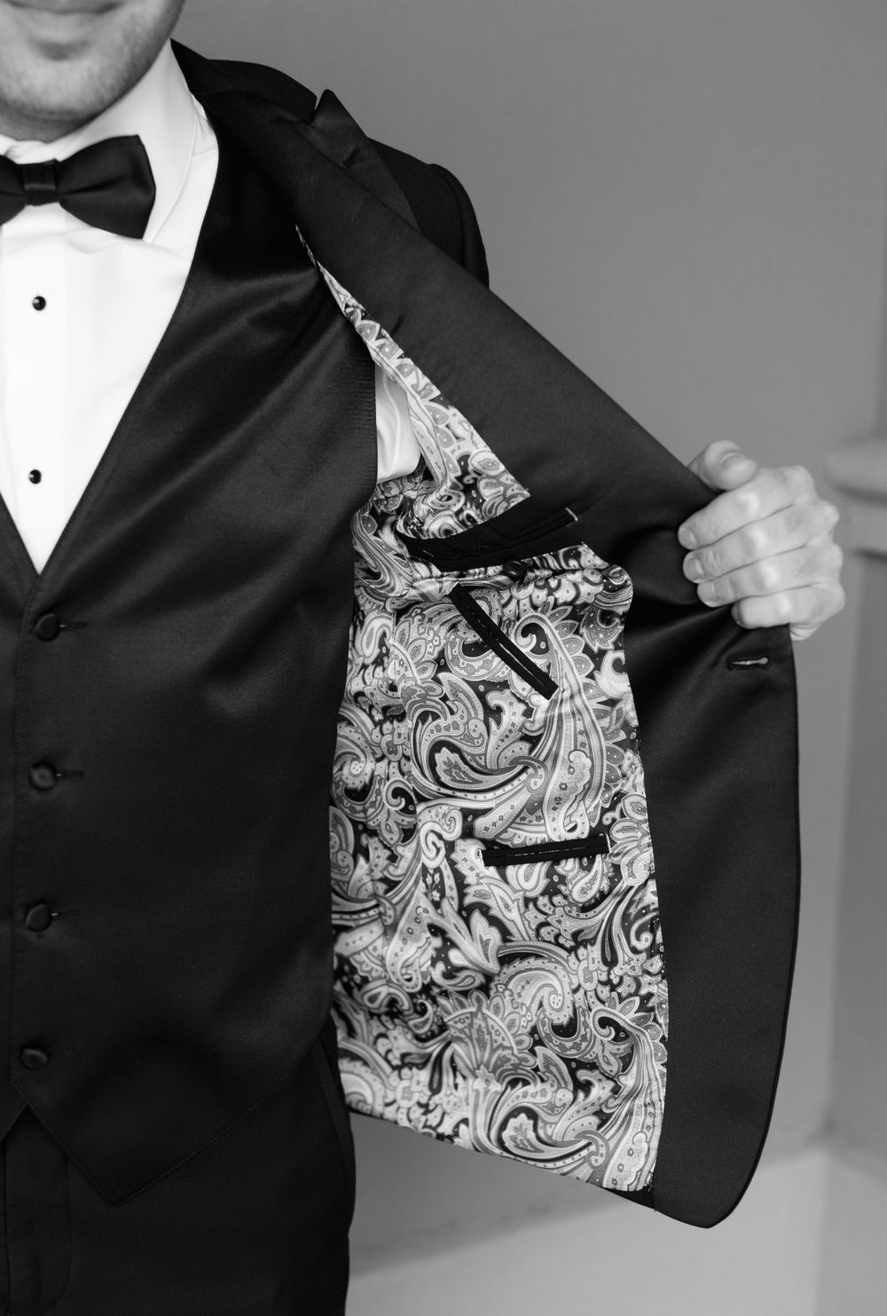 Close-up of tuxedo jacket revealing decorative paisley print lining.
