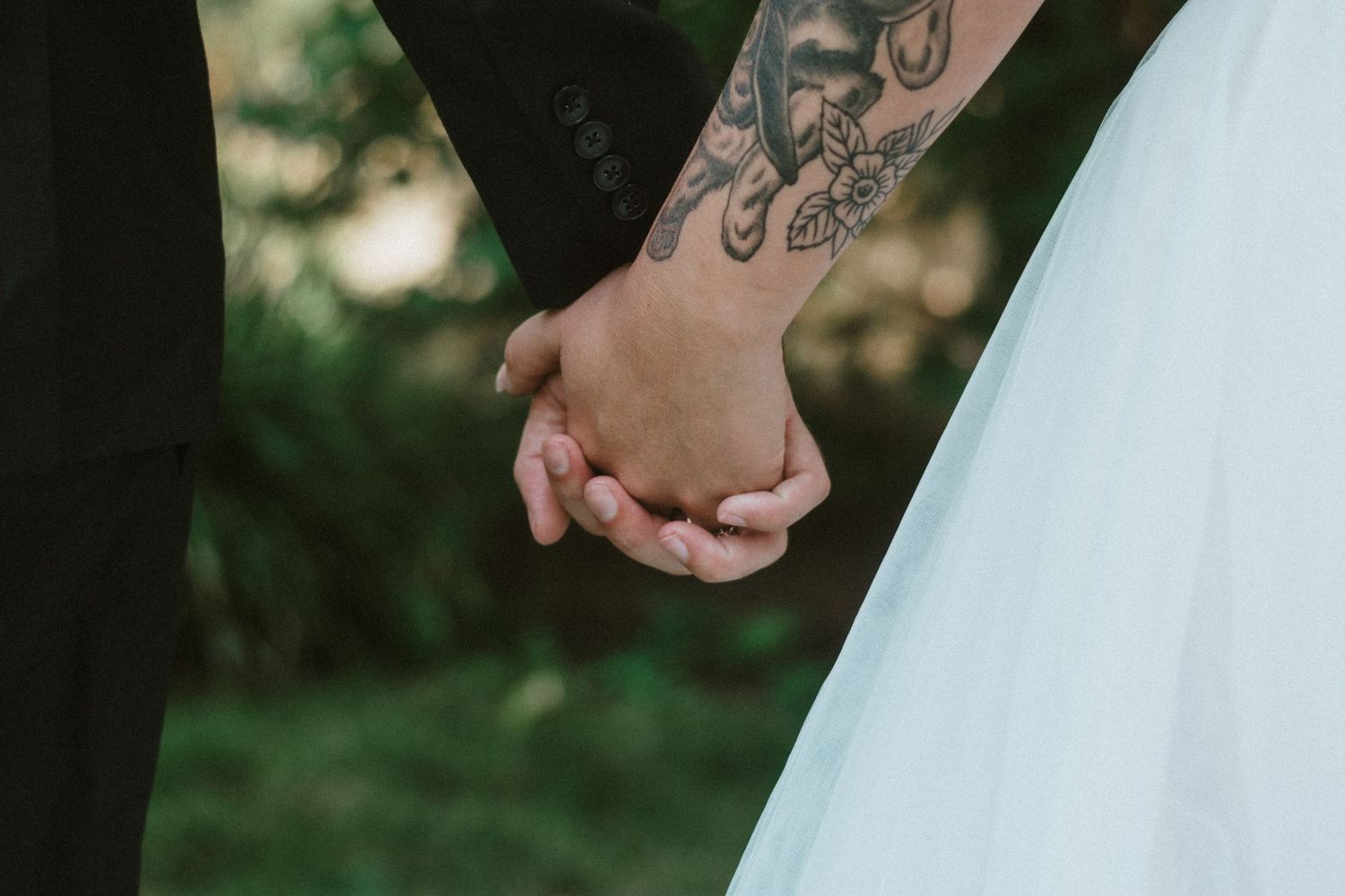hand holding bride and groom idaho