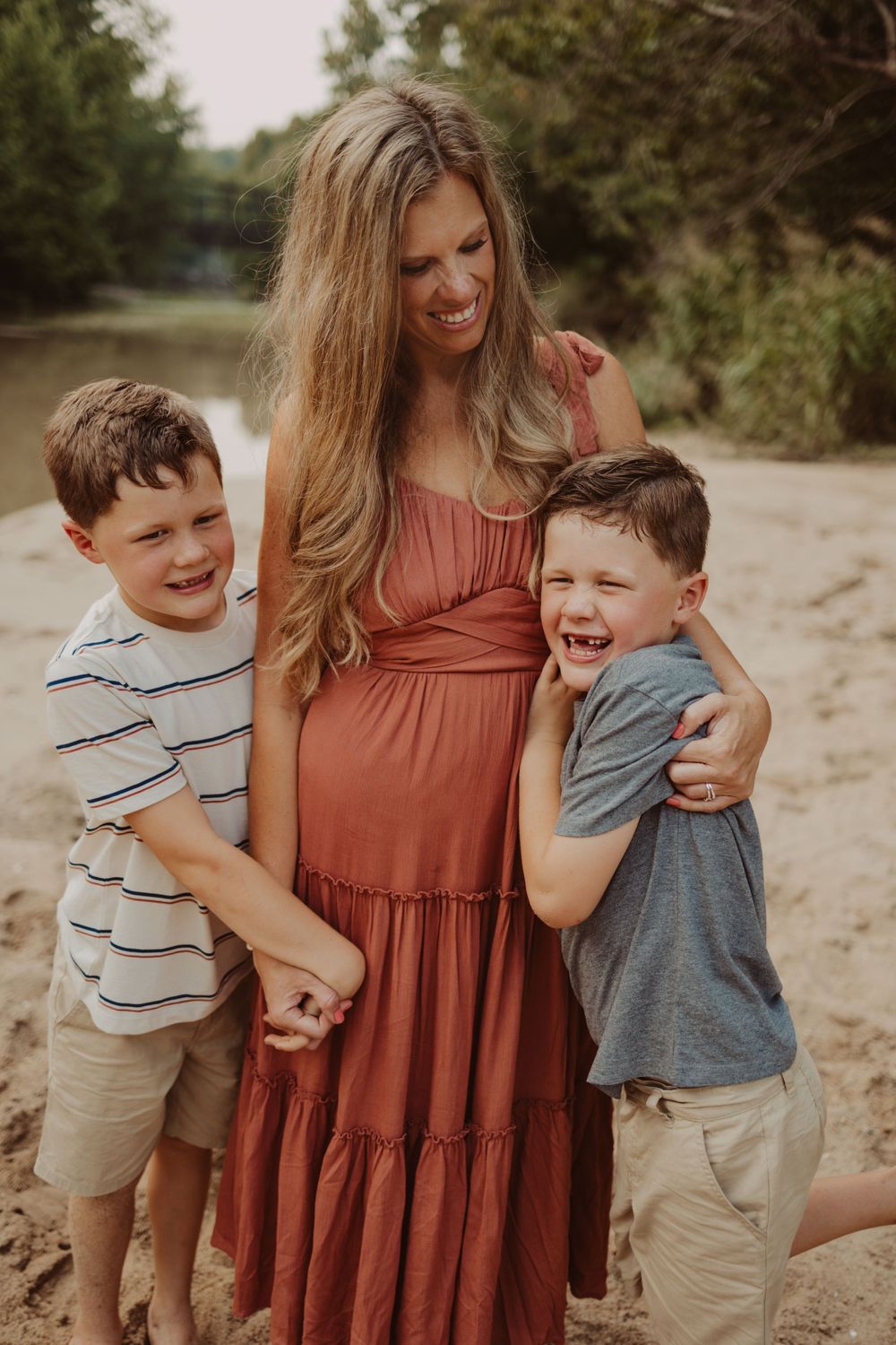 snuggles for mom during creek family photography session
