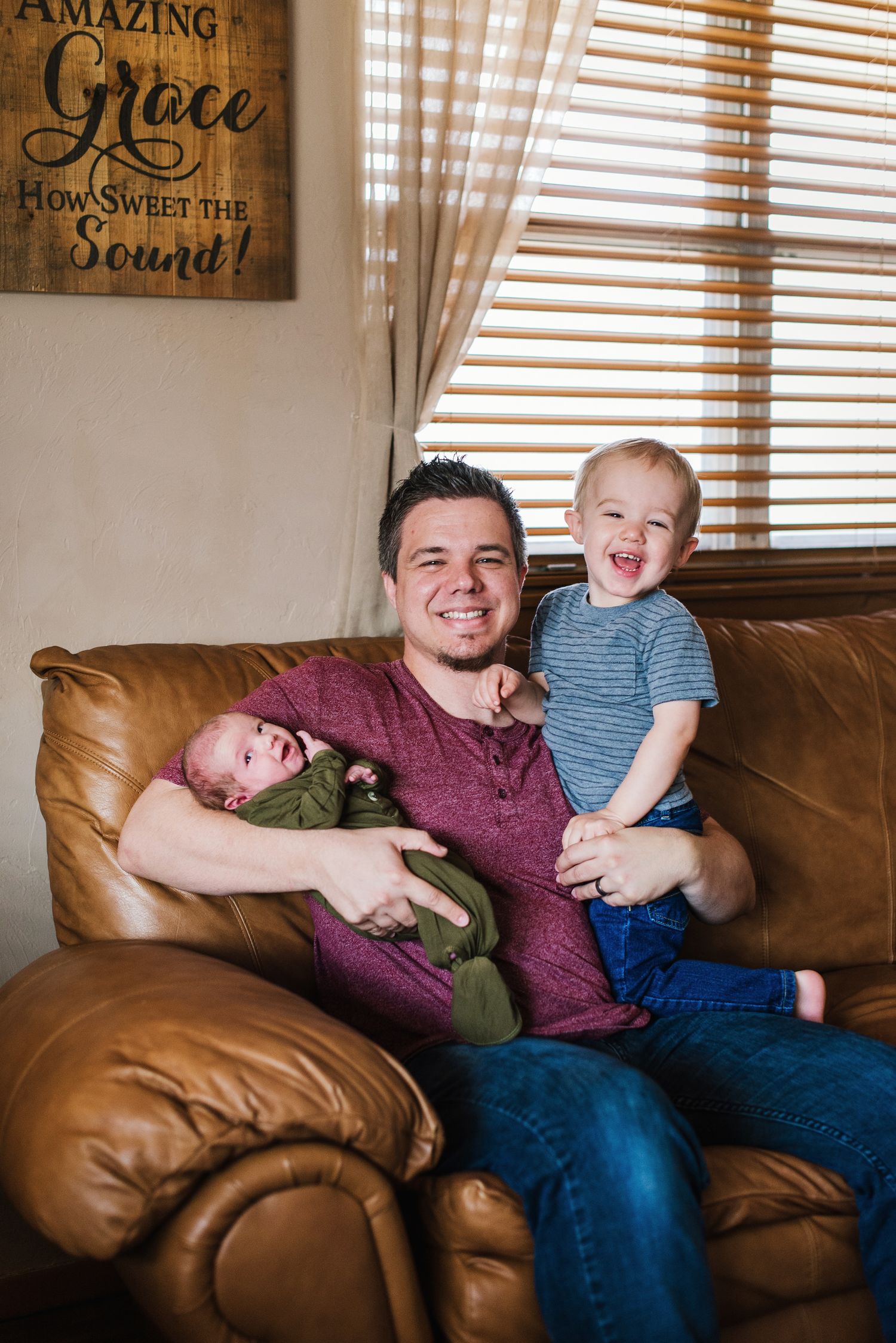 In-home lifestyle newborn family photo session by Wichita photographer