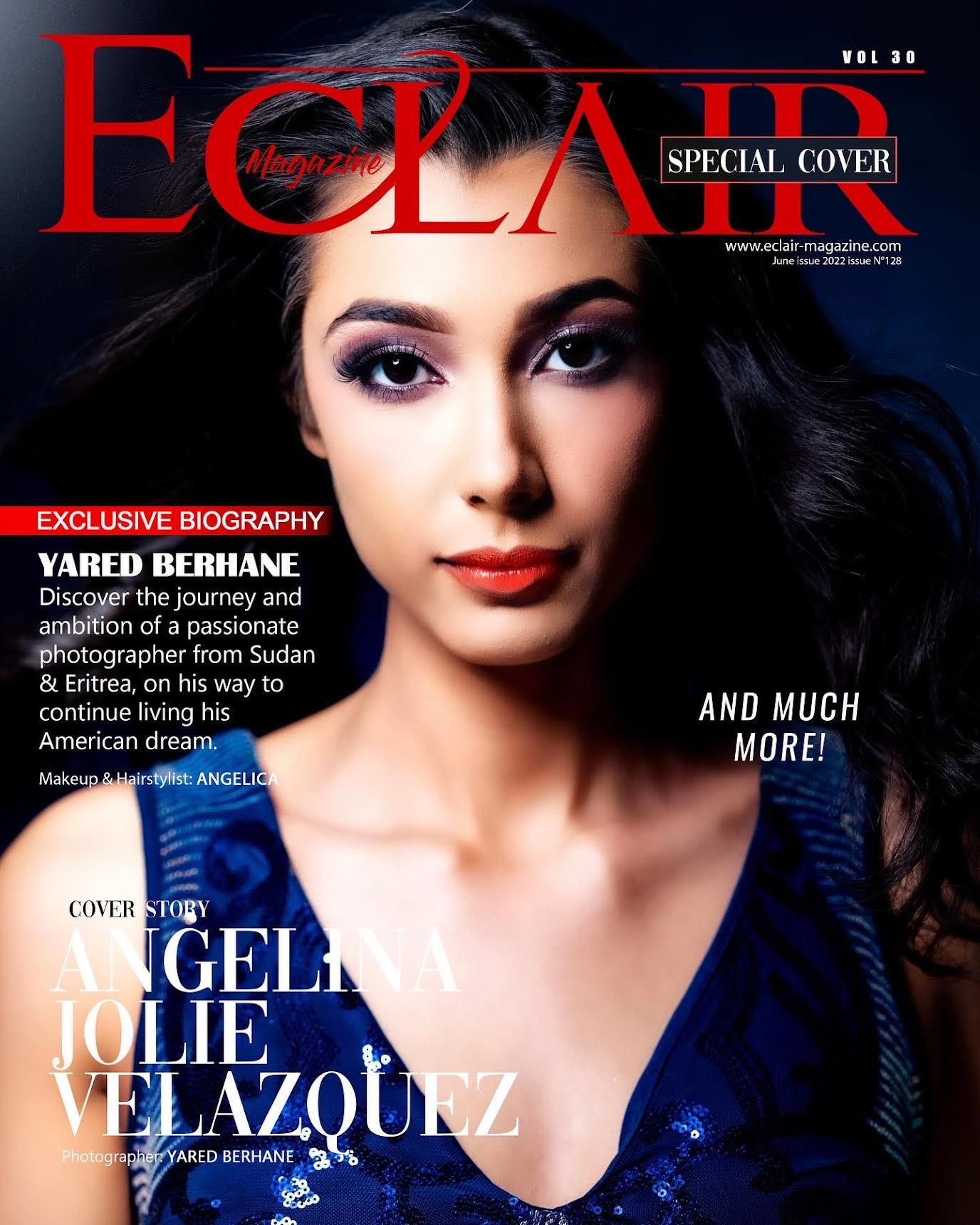 Fashion magazine cover featuring model in blue dress on dark background.