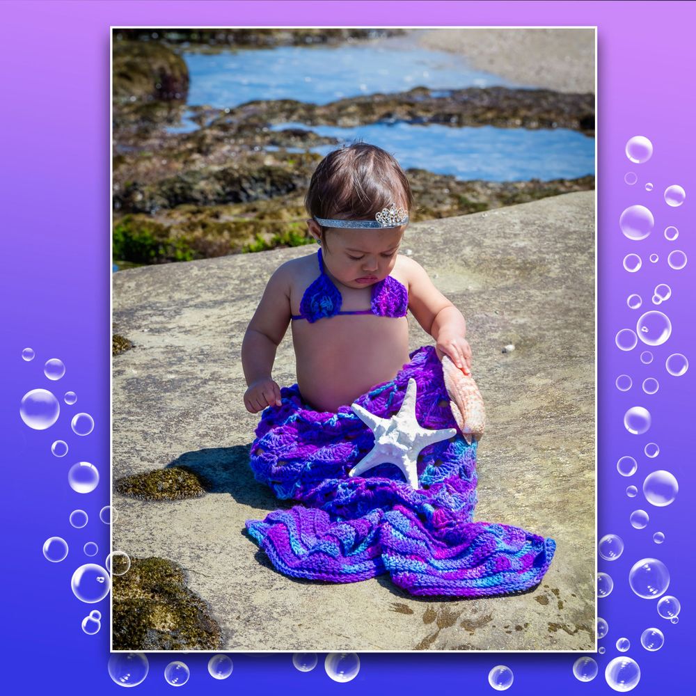 Coastal photoshoot with bubbles border featuring purple mermaid tail and starfish.