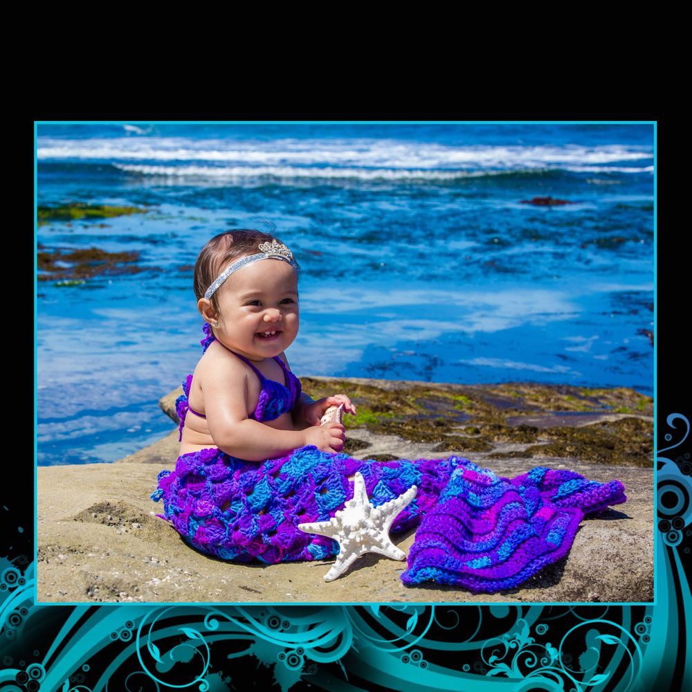 A seaside photoshoot featuring a sparkly purple mermaid tail and white starfish prop.