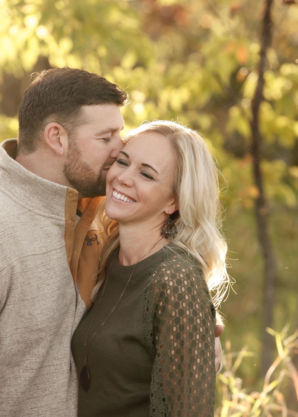 Romantic outdoor photoshoot sequence capturing natural laughter and affection.