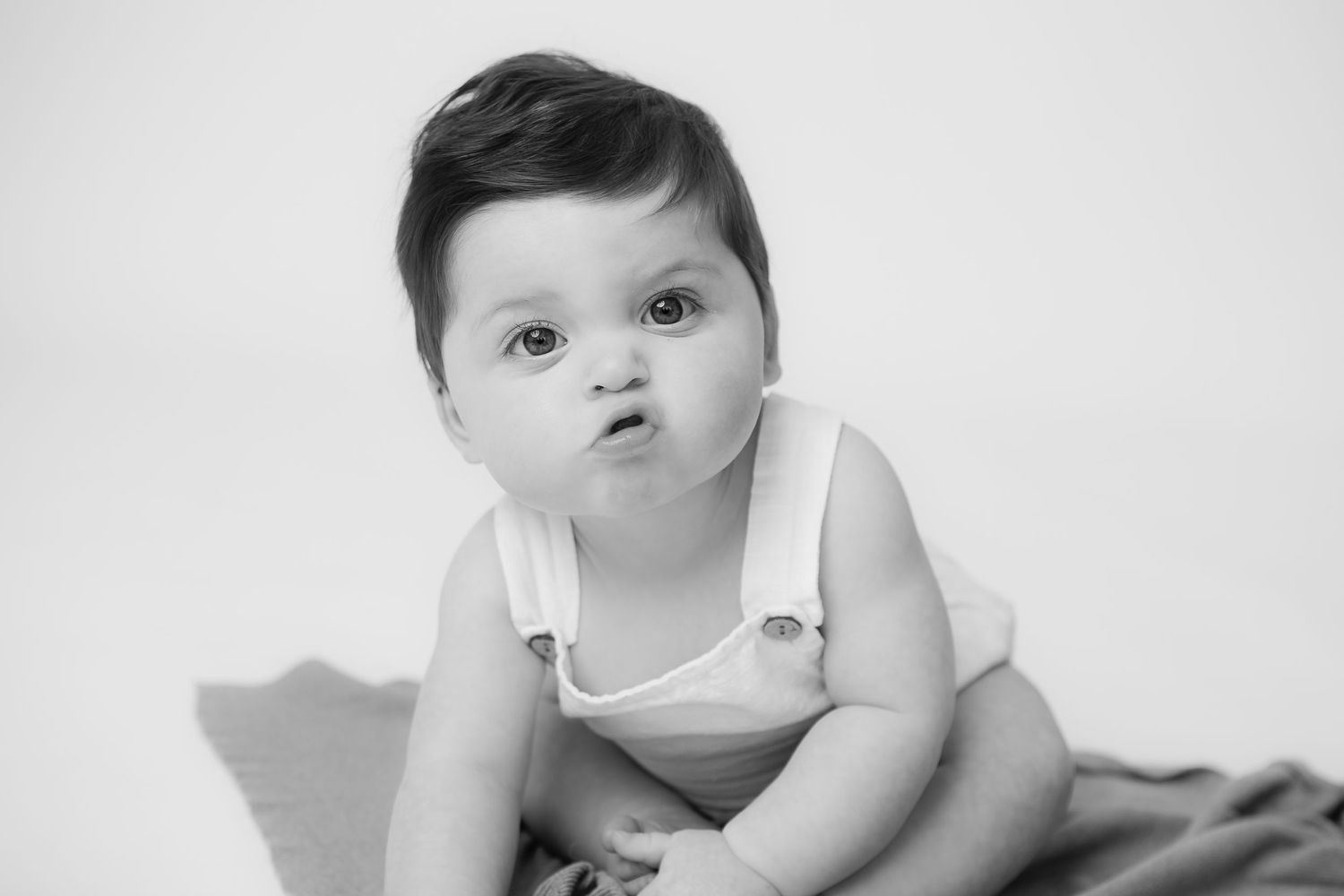 Black and white portrait capturing an innocent expression.