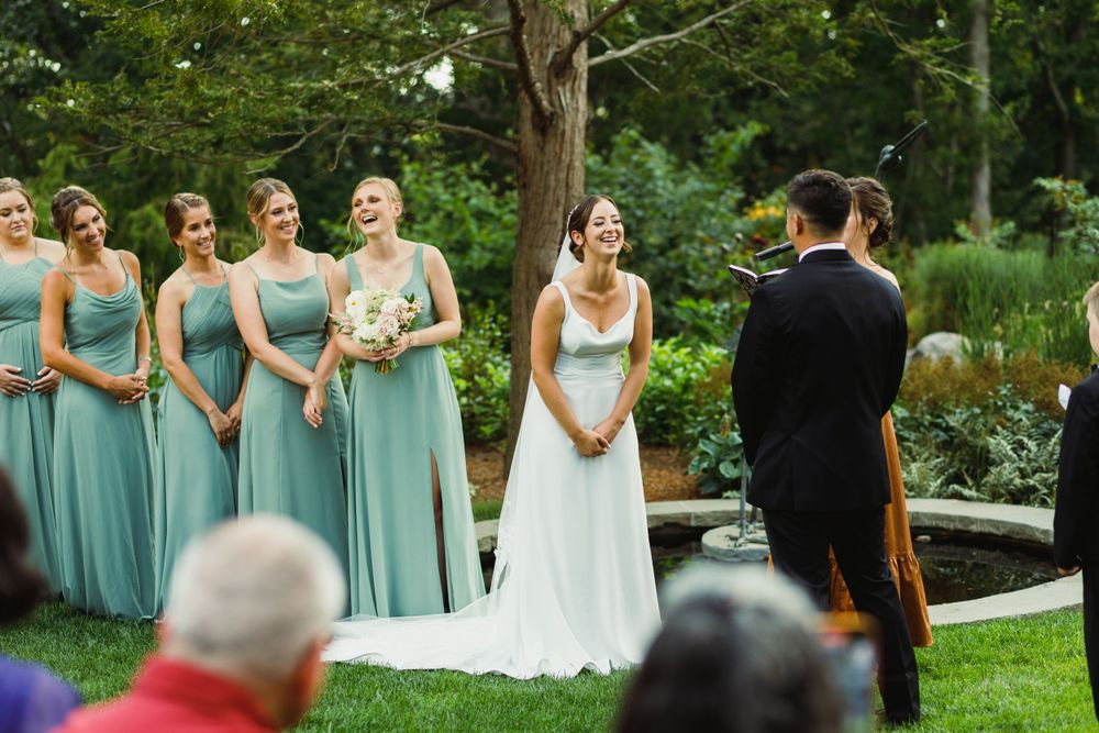Wedding ceremony processional in a beautiful garden setting with elegant decor.