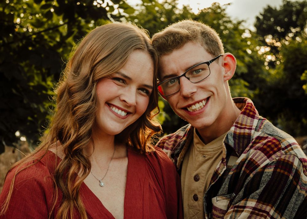 Couple cuddles close during photoshoot.