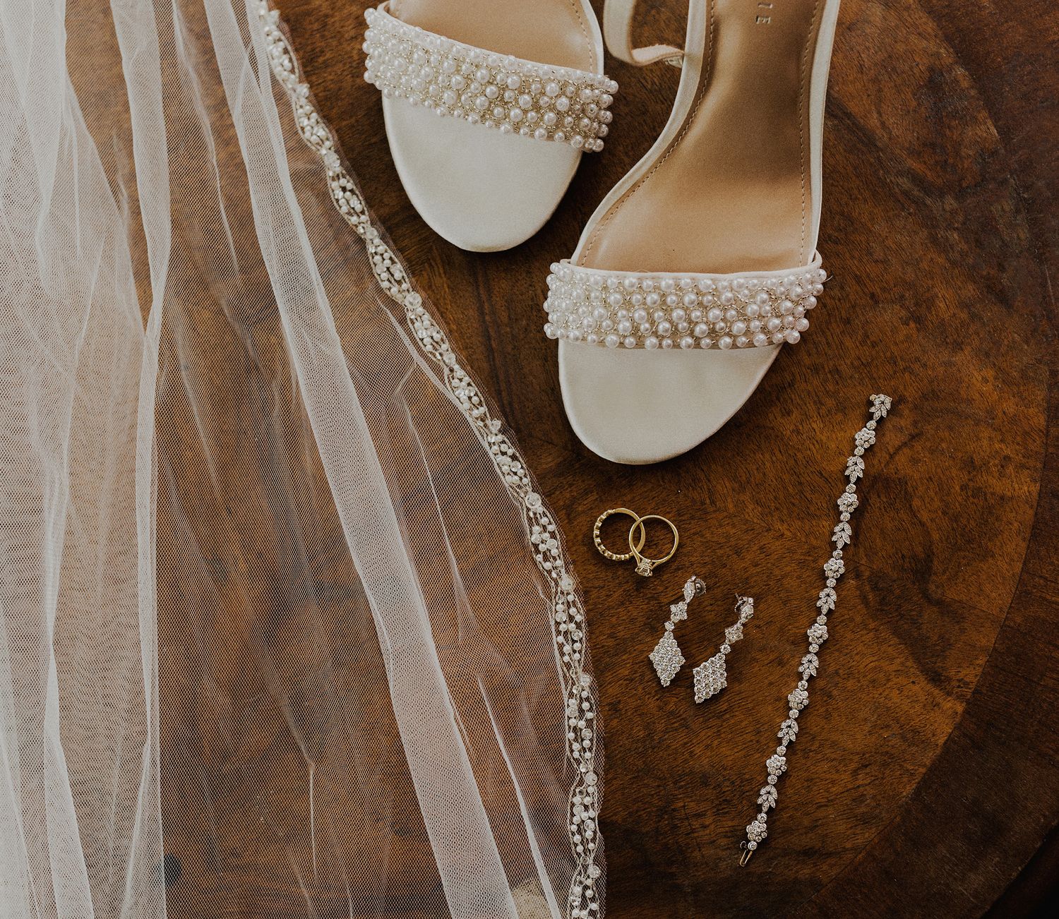E Noelle Photography in-home wedding in Hidden Hills Los Angeles, bride ring, veil and jewelry detail shot