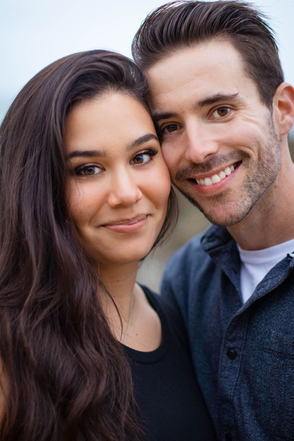 Close-up portrait series showing couple sharing intimate moments against dark background.