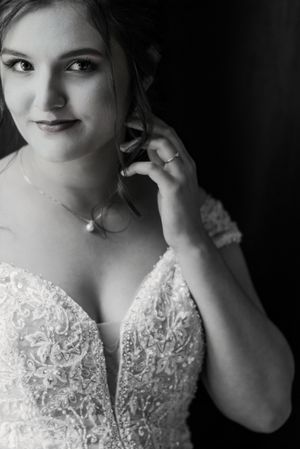 Black and white bridal portrait showing detailed lace bodice.