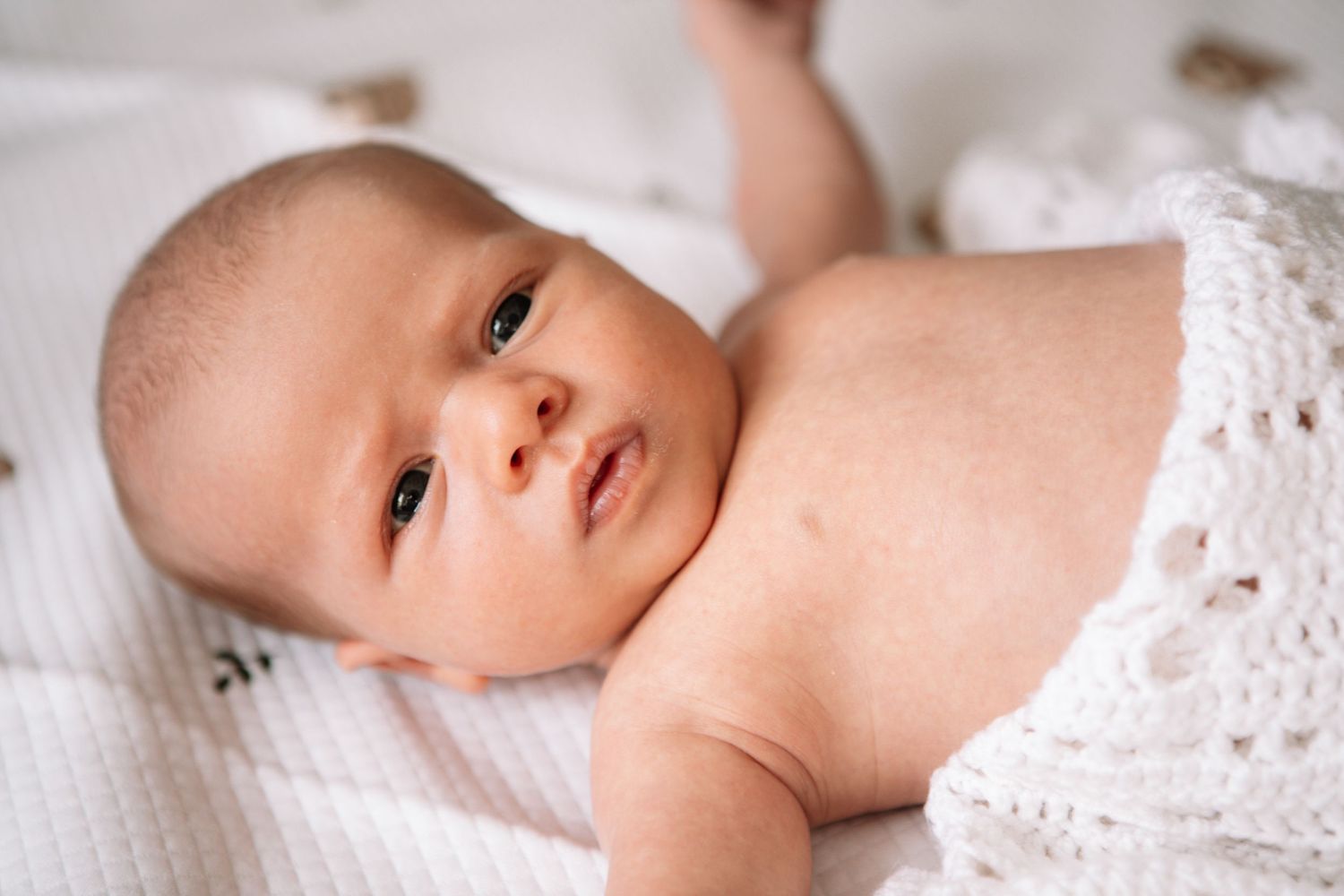 New born at home photo shoot with Cornwall new born photographer knitted blanket