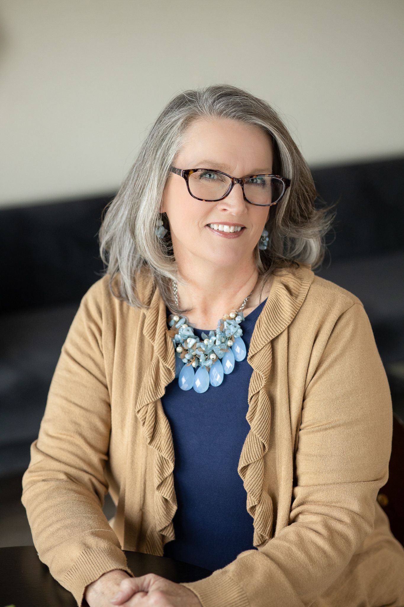 Woman posing in a coffee shop for professional headshots