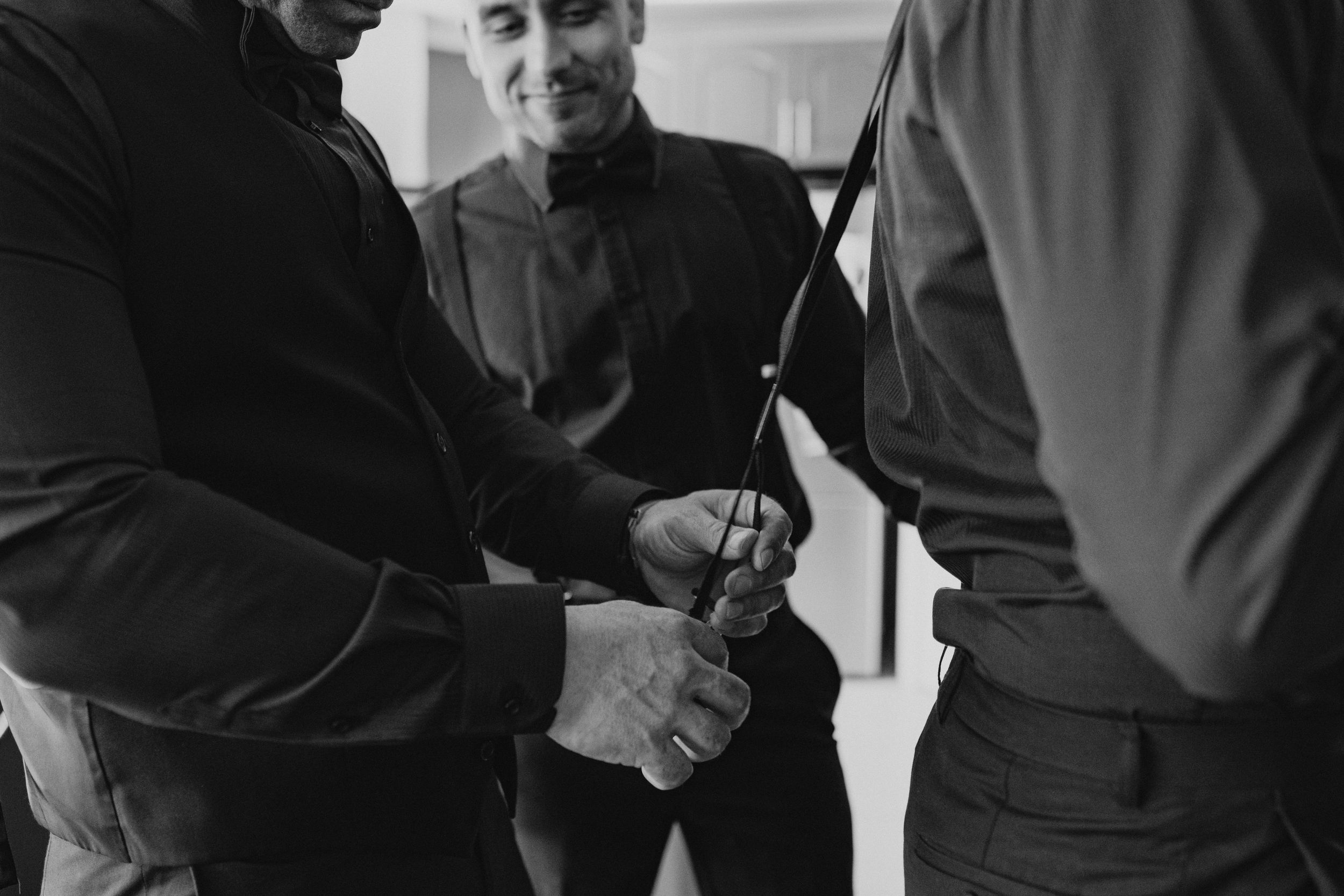 grooms men getting ready for wedding