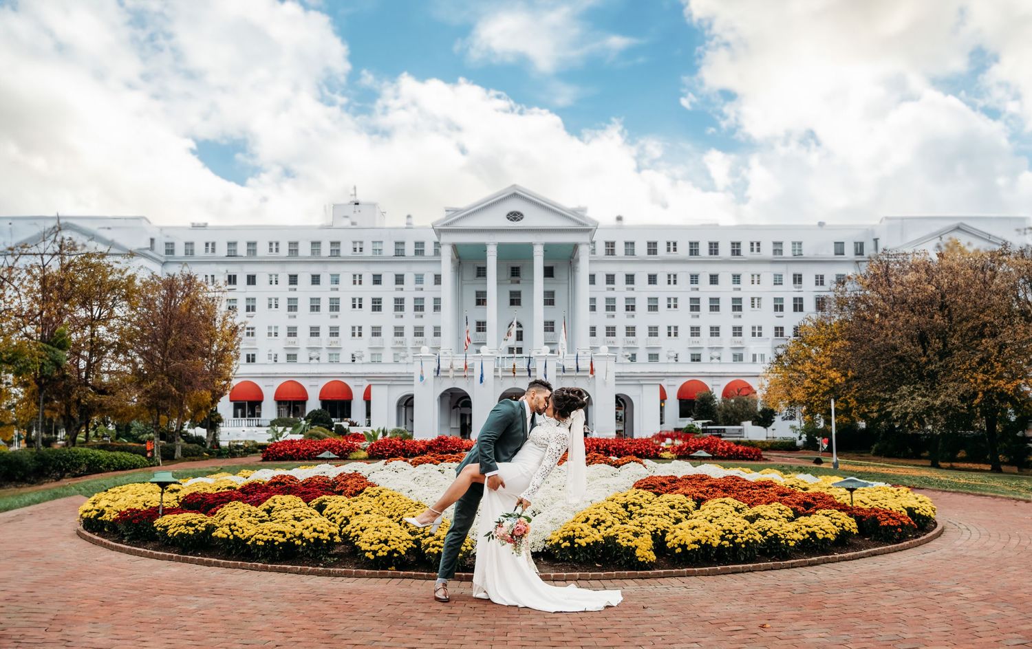 African American couple share a dip kiss in front of The Greenbrier hotel in White Sulphur Springs, WV