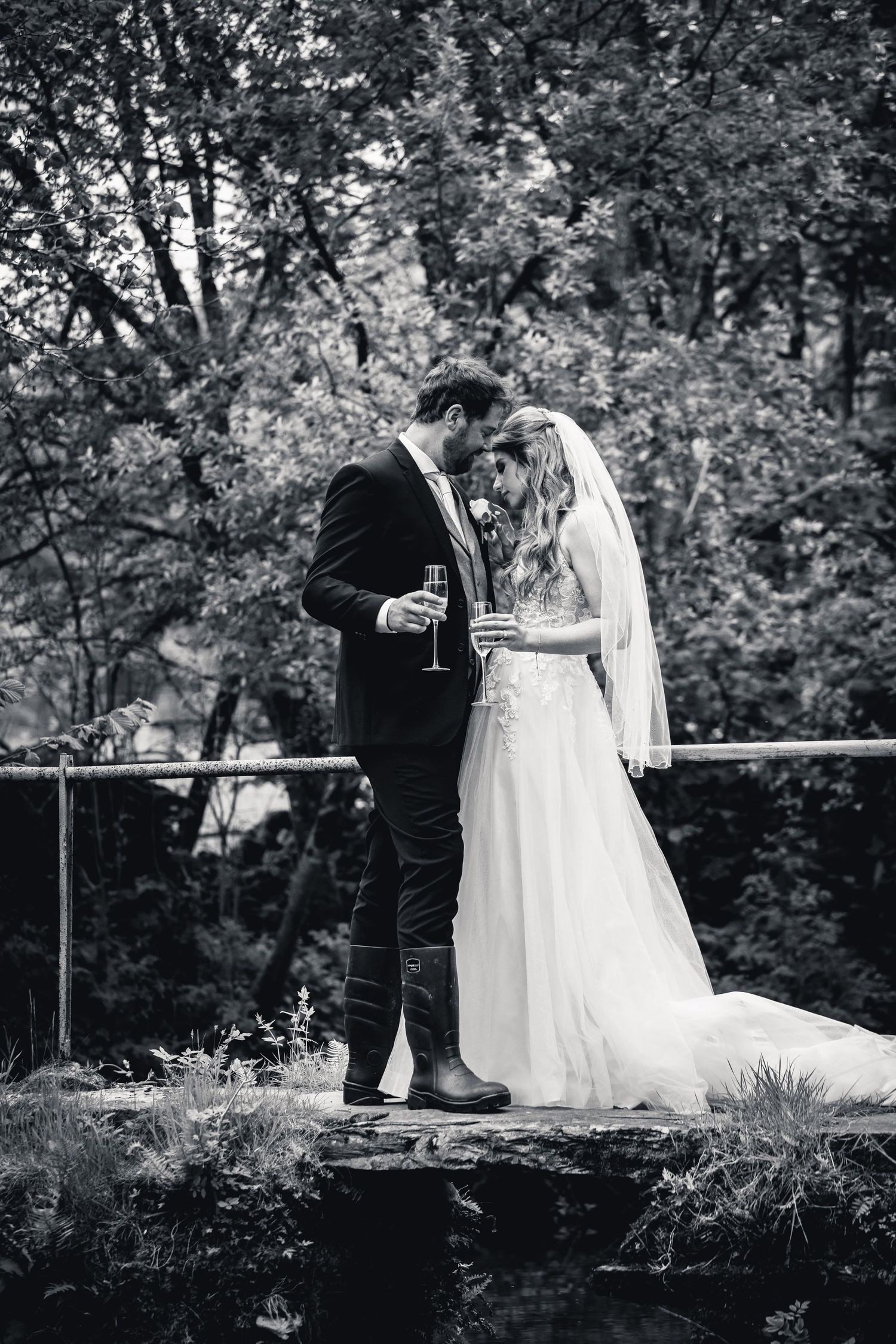 Romantic black and white moment shared between a couple on their wedding day.