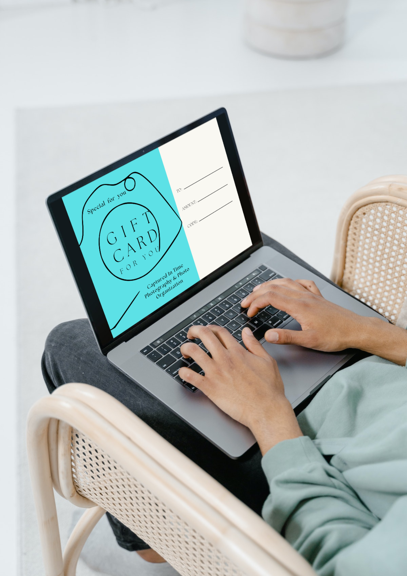 a person holding a computer for a gift card