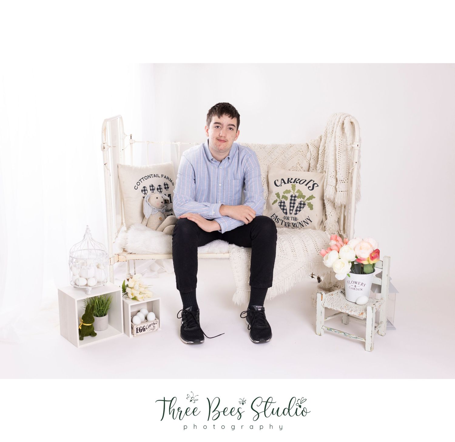 Simple studio portrait with vintage white furniture and farmhouse decor.