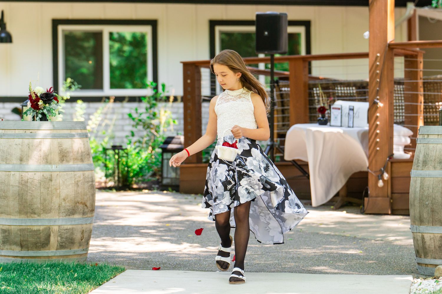 flower girl throws petals