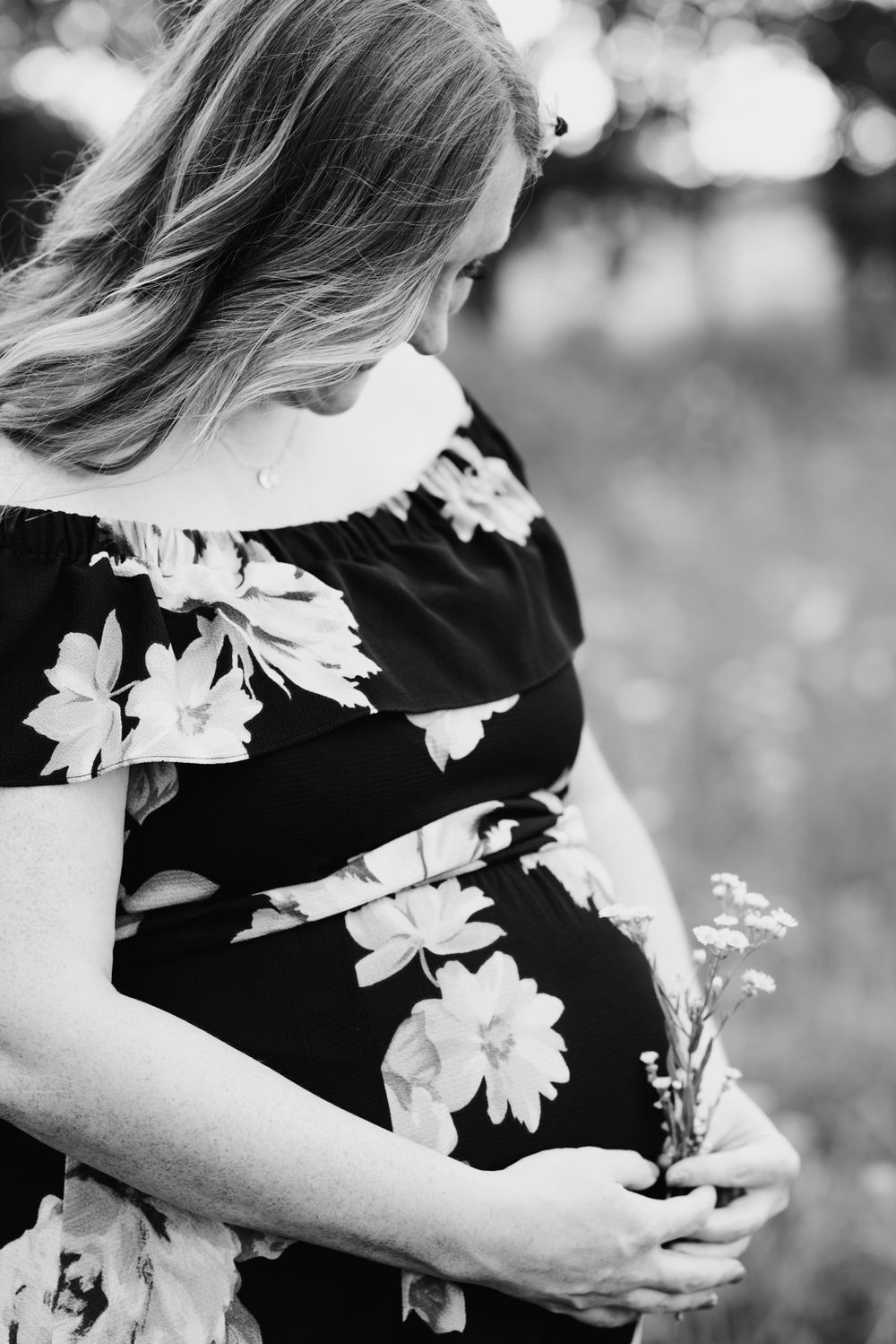 An expecting mother holding her child