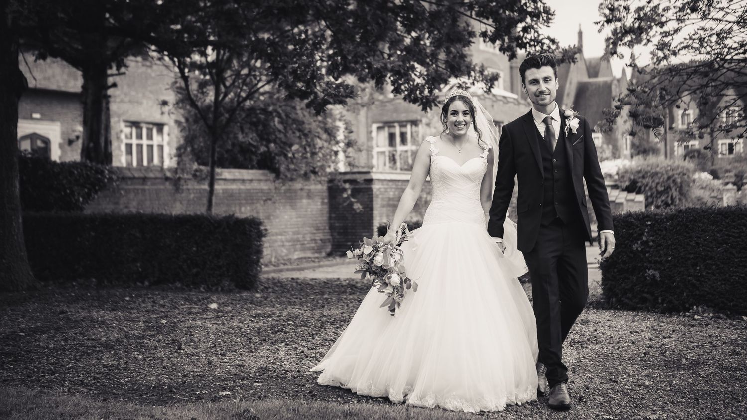 bride and groom walking together at church