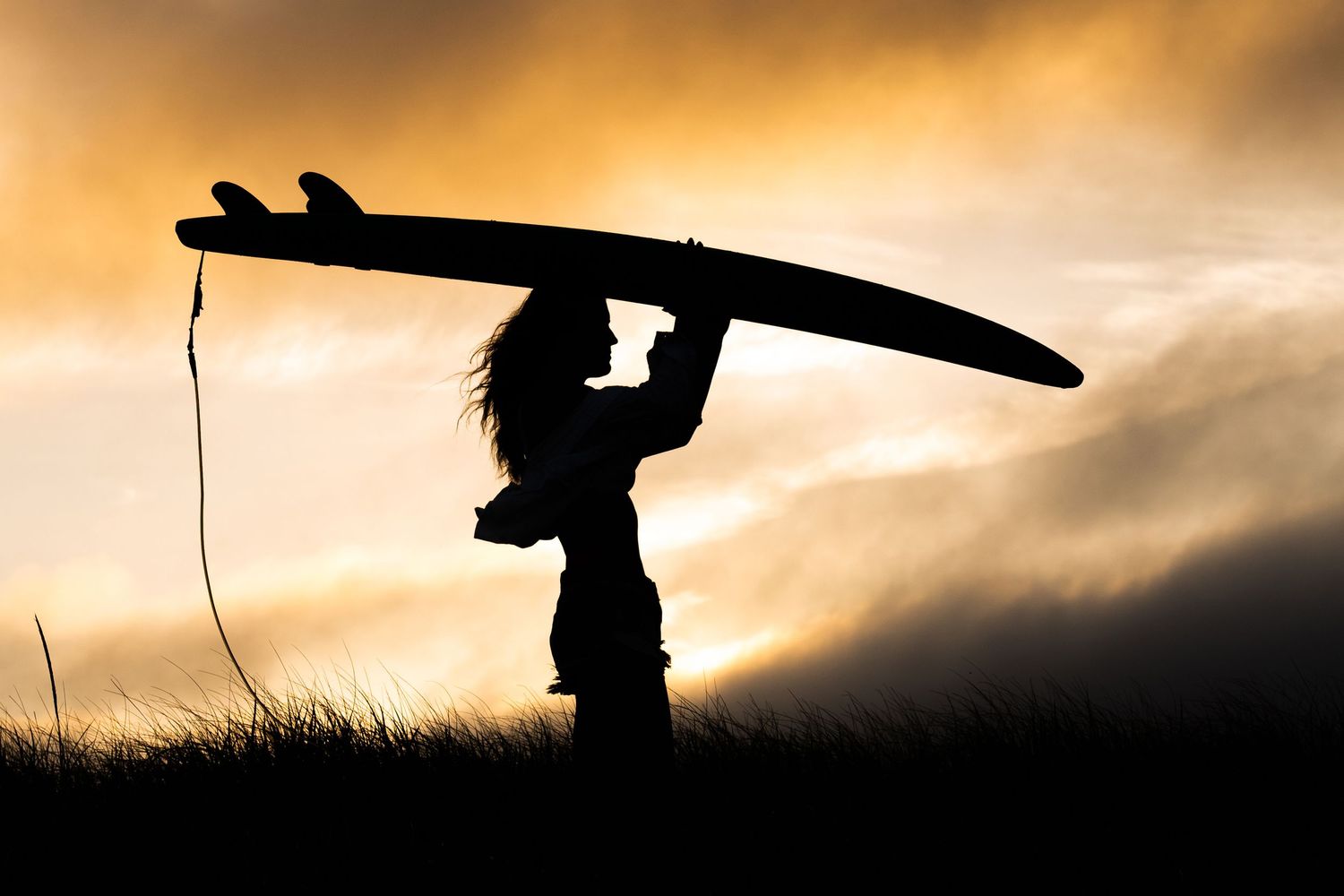Plymouth, MA photographer Heidi Harting makes stunning sunset silhouette images of high school seniors