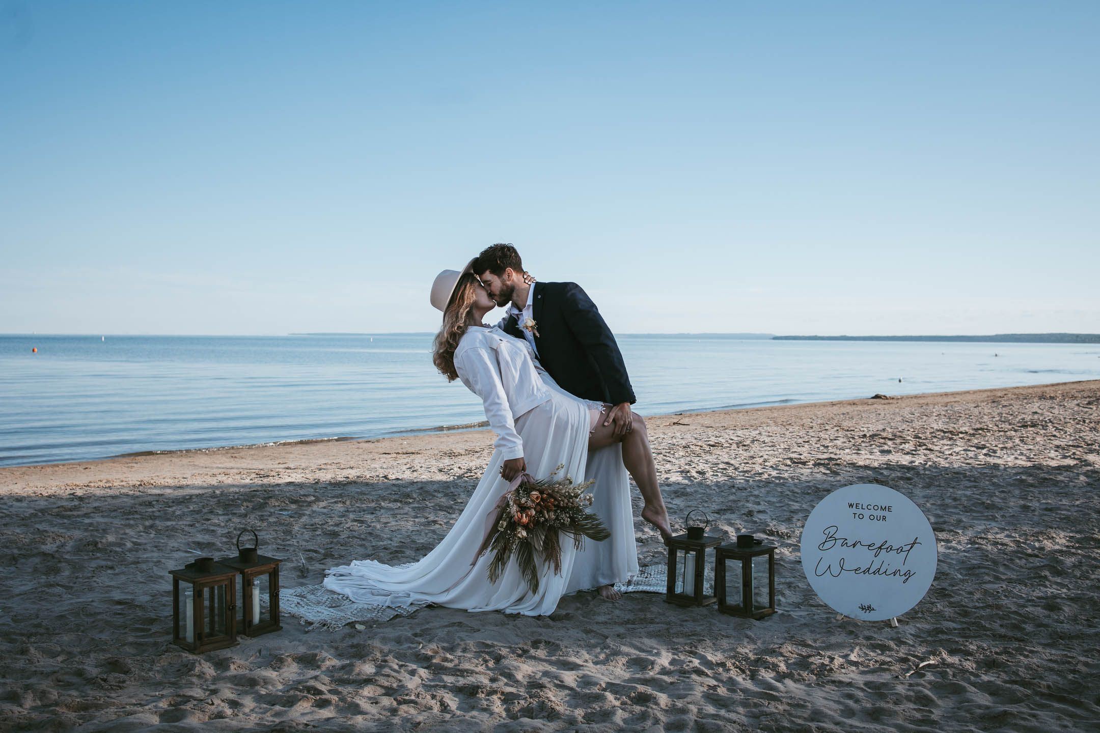 Romantic wedding photo on the beach in Collingwood Ontario for a luxury elopement wedding