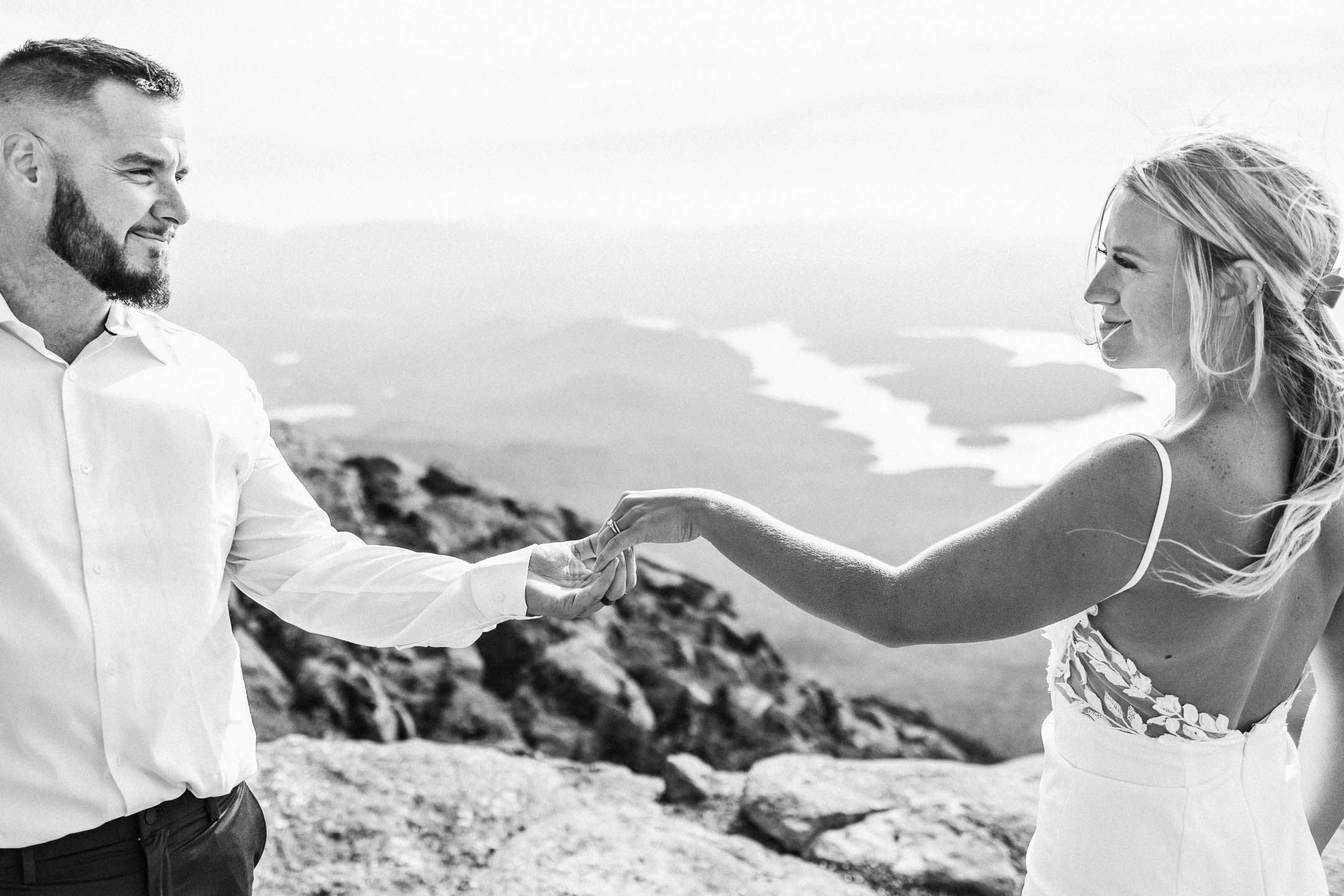 Intimate moment between bride and groom on a adventure mountain elopement in New York state