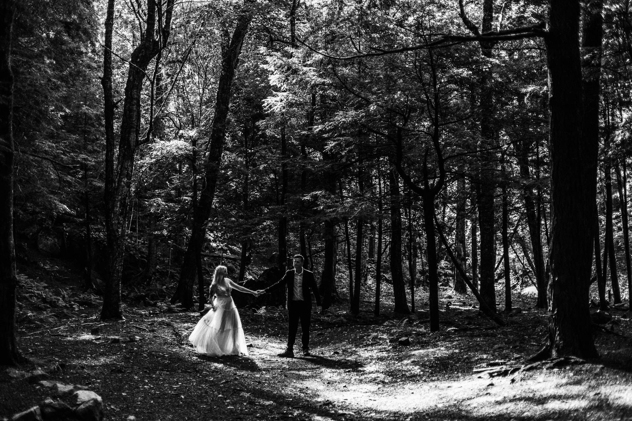 Beautiful black and white wedding photo in a forest area for an adventure elopement