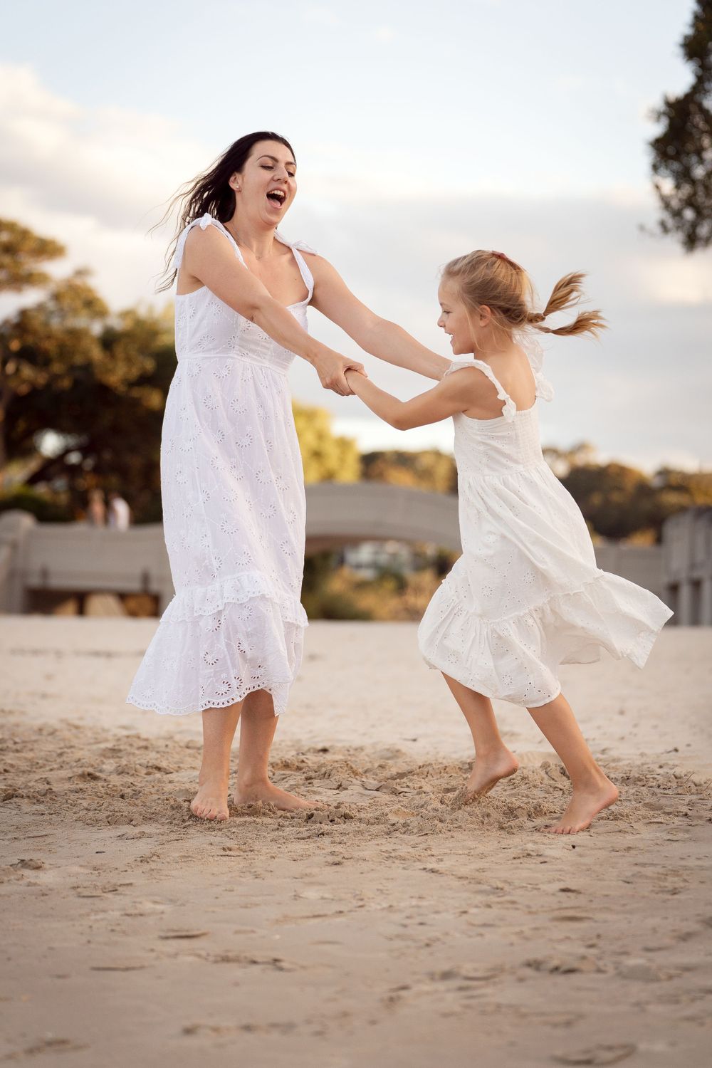 Mom and Daughter is dancing during family photoshoot in Mosman