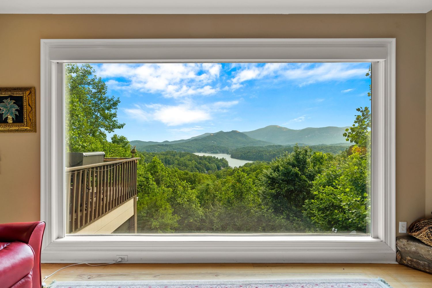 Lake Lure, NC. Luxury home with large window overlooking the river and mountains. By Virtually Calhoun
