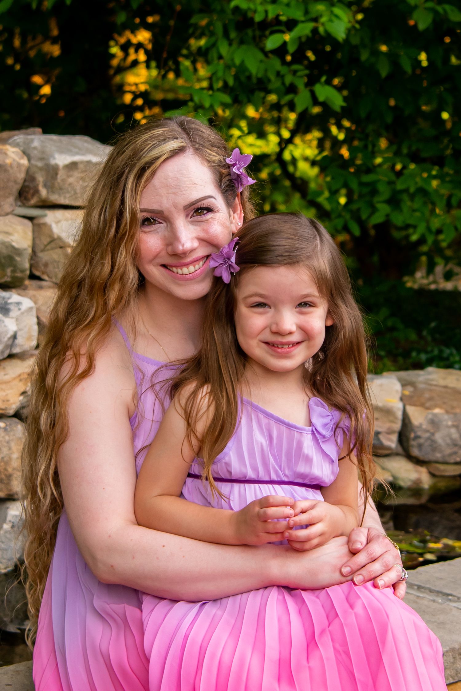 four year old girl with her mom in matching dresses