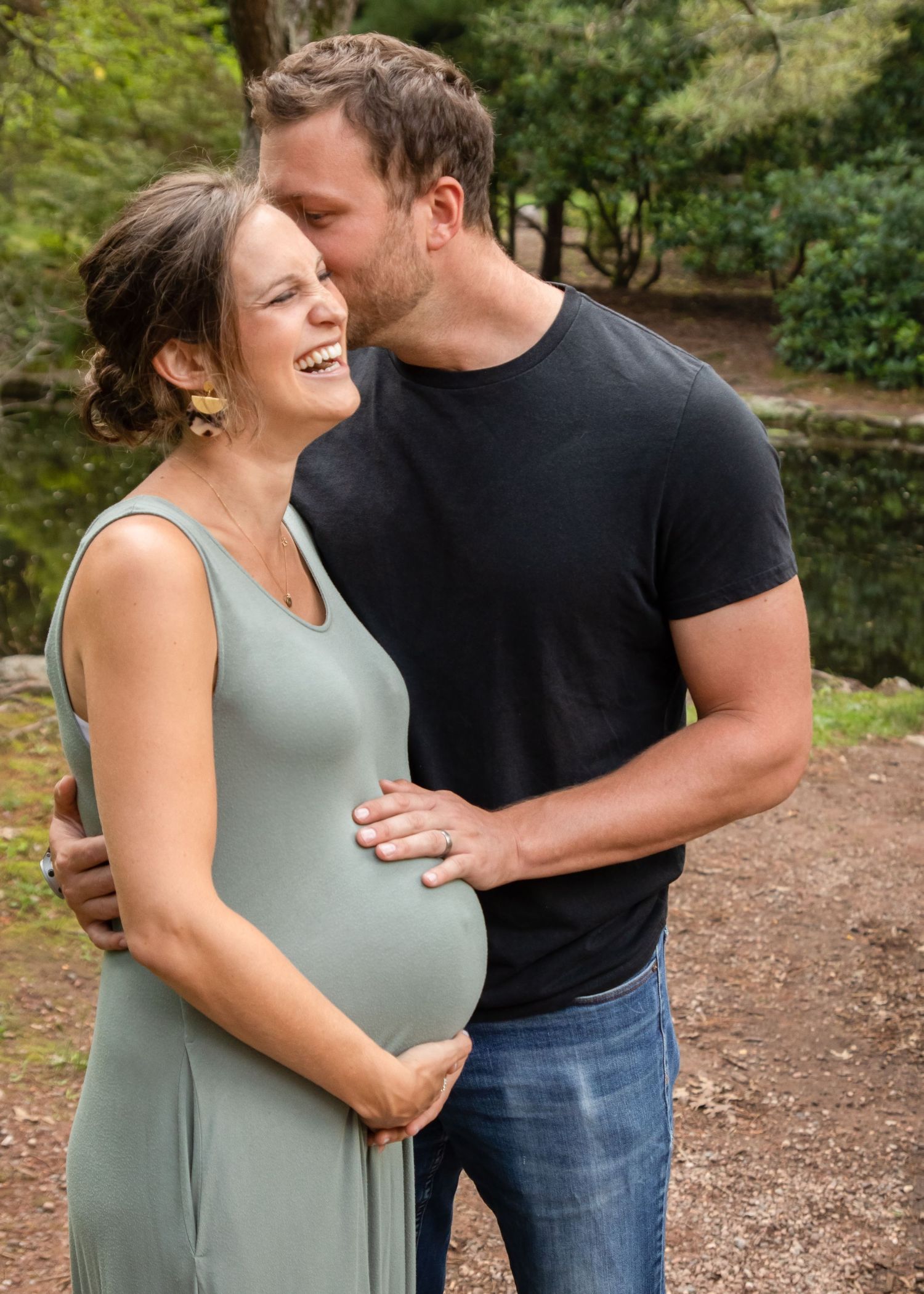 couple laughing maternity portrait Wickham Park, Manchester, Connecticut