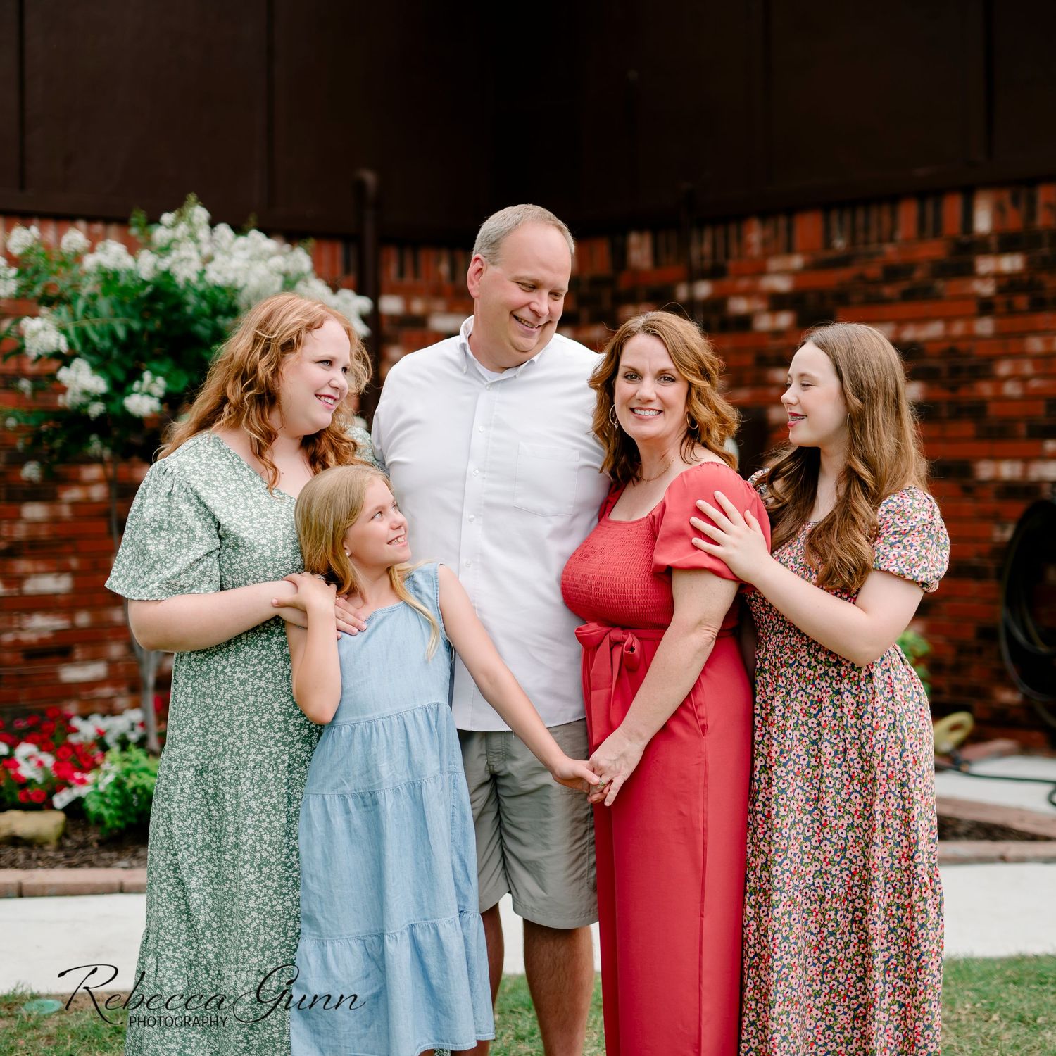 Tulsa family photography session with family of five; parents and three girls in floral and solid prints